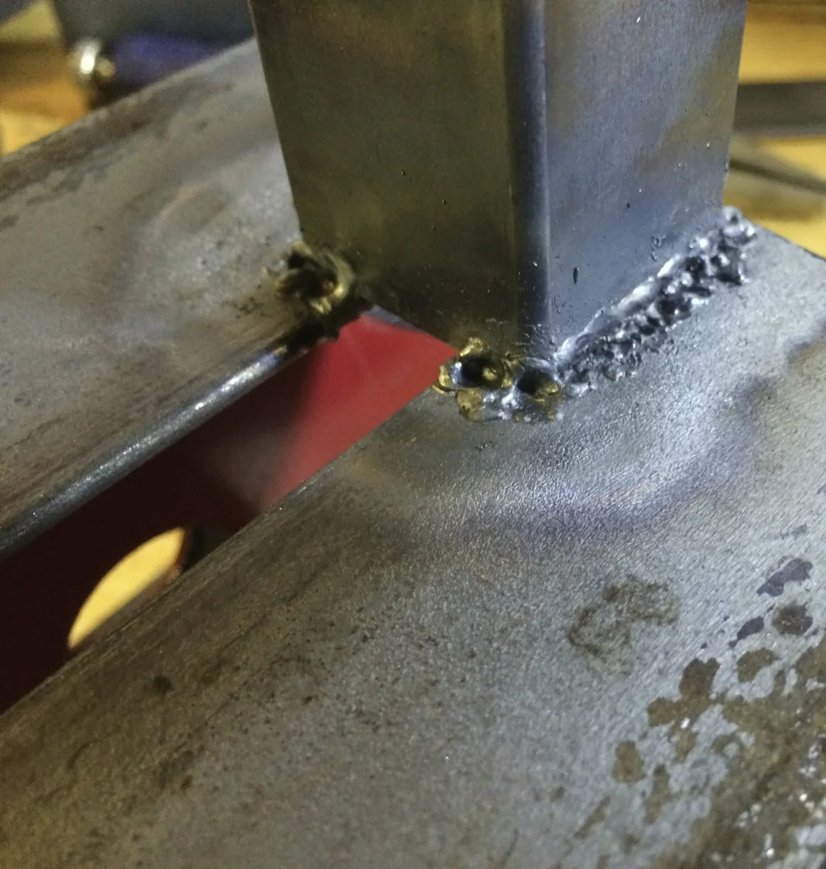 My quite poor welds between the square tubing and the angle iron.