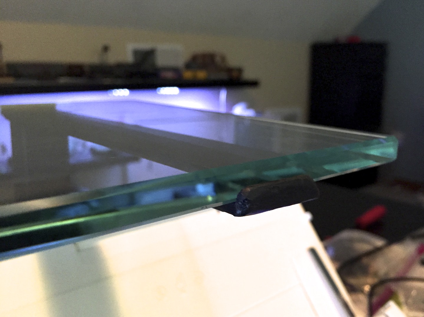 One of the lips that keeps the shelf from slipping.