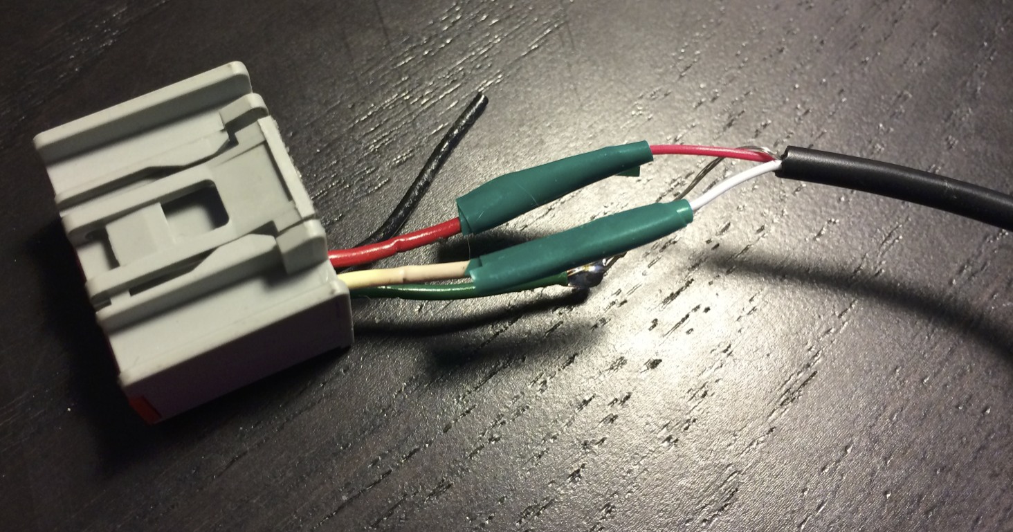 The XM connector's wires solder to a headphone cable.