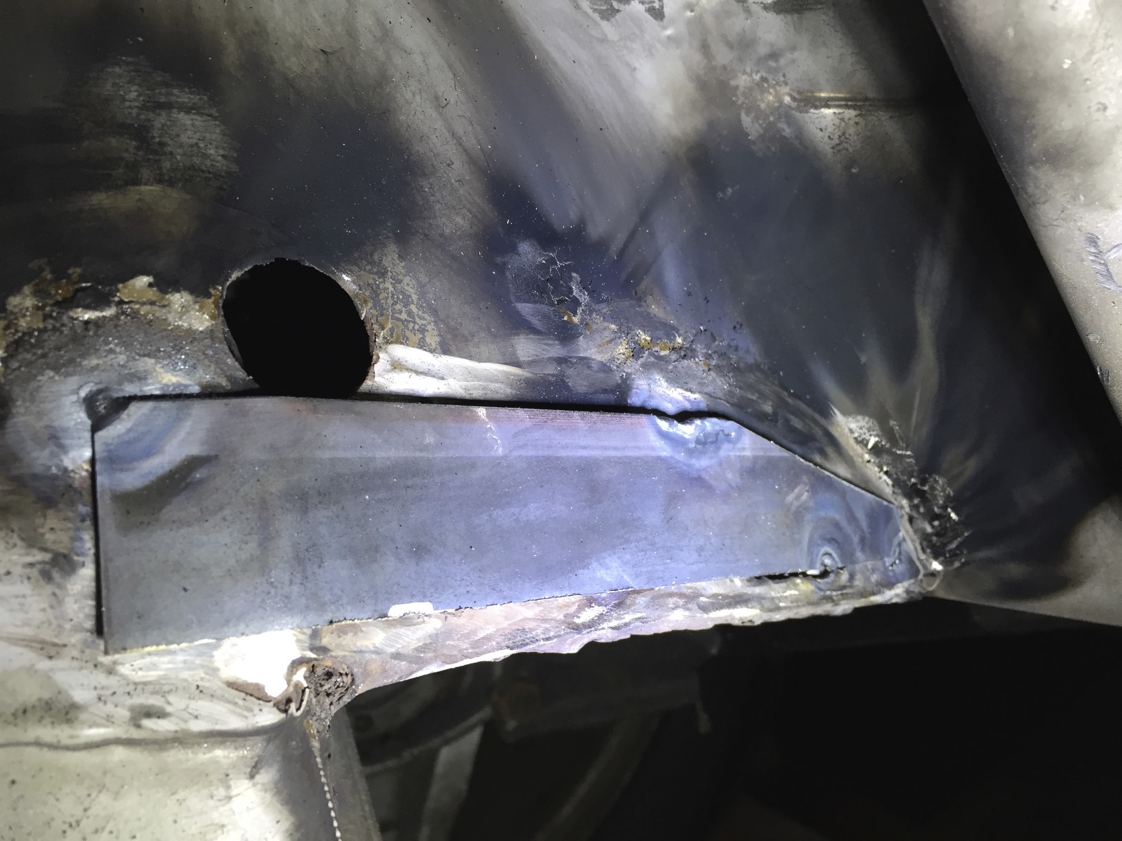 The patch tacked down from one corner. It had to be shifted a little due to being misaligned at the lower right.