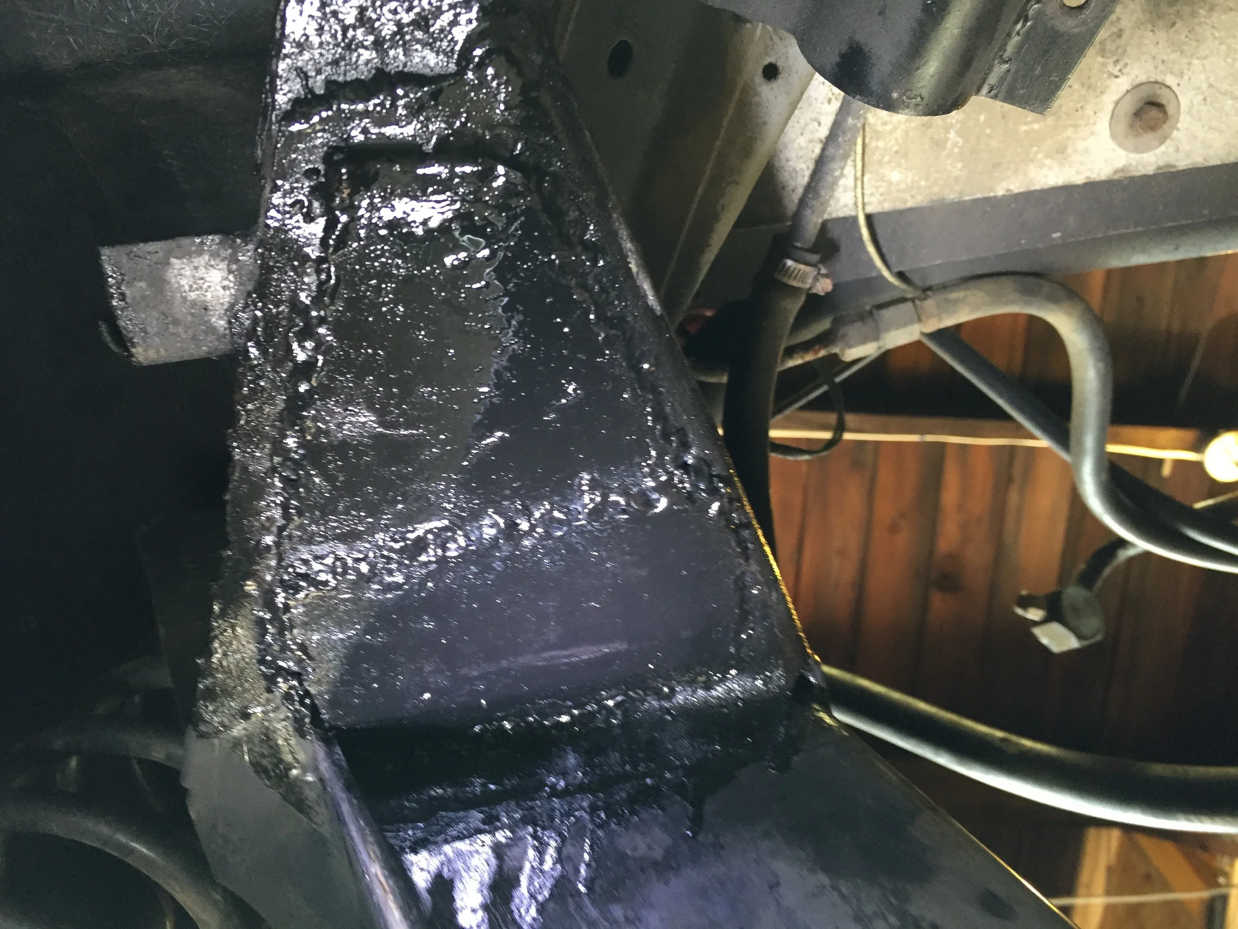Passenger side weld covered with POR-15.