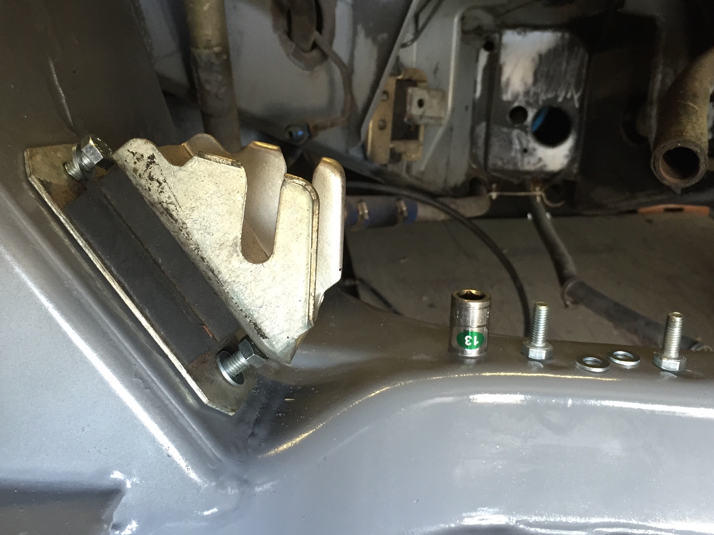 New engine mount partially installed on the frame.