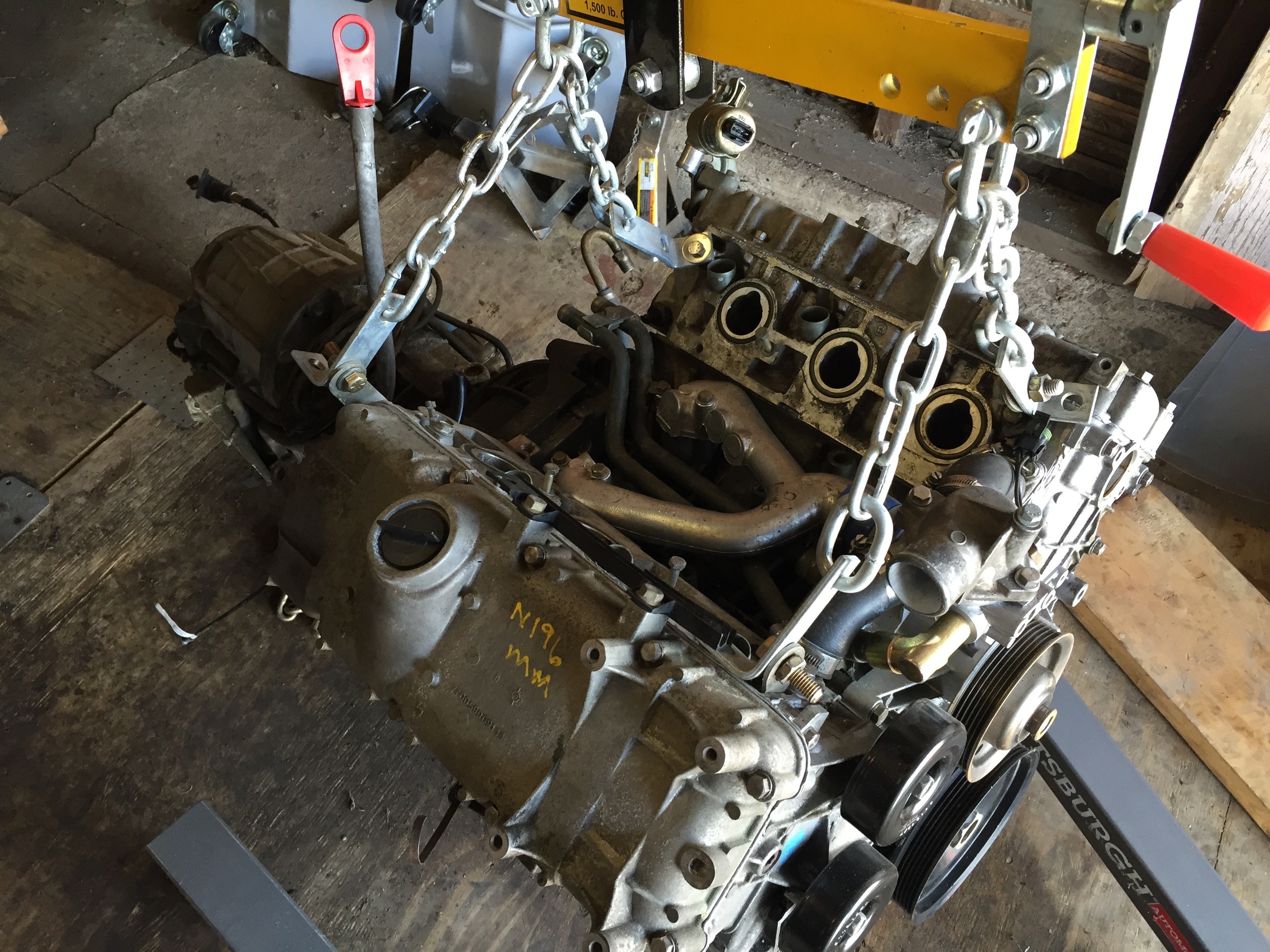 All four chains attached to the block.