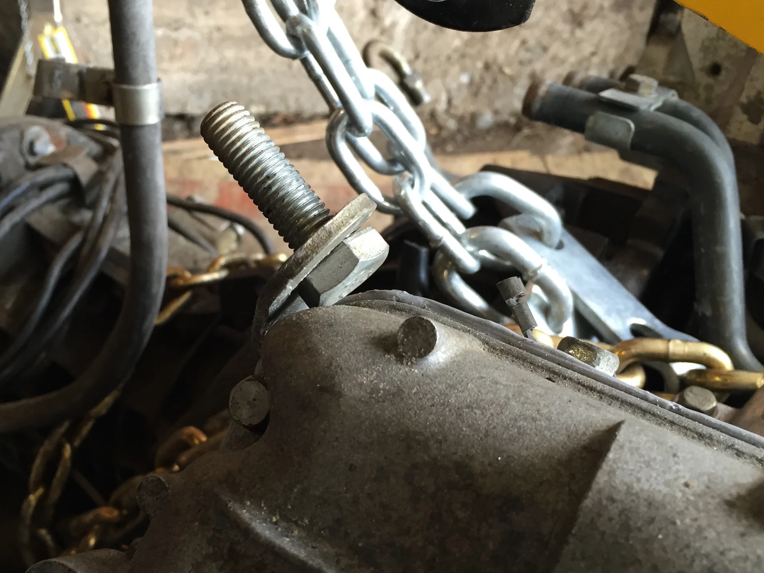 A bolt through one of the lift rings. The ring was bent back towards the head, but was easily pried back to vertical.