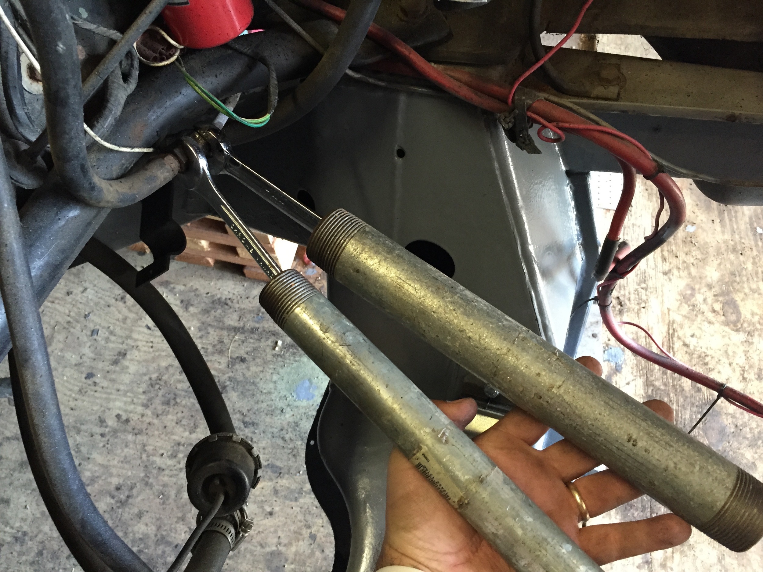 Pipes added leverage and made turning the wrenches more comfortable.