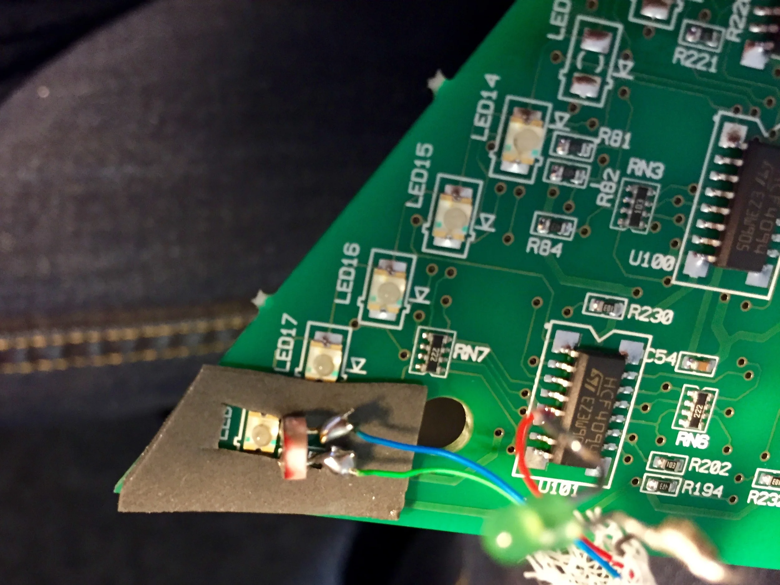 VHB tape surrounding the LED in the corner of the board, with the photcell aimed at it.