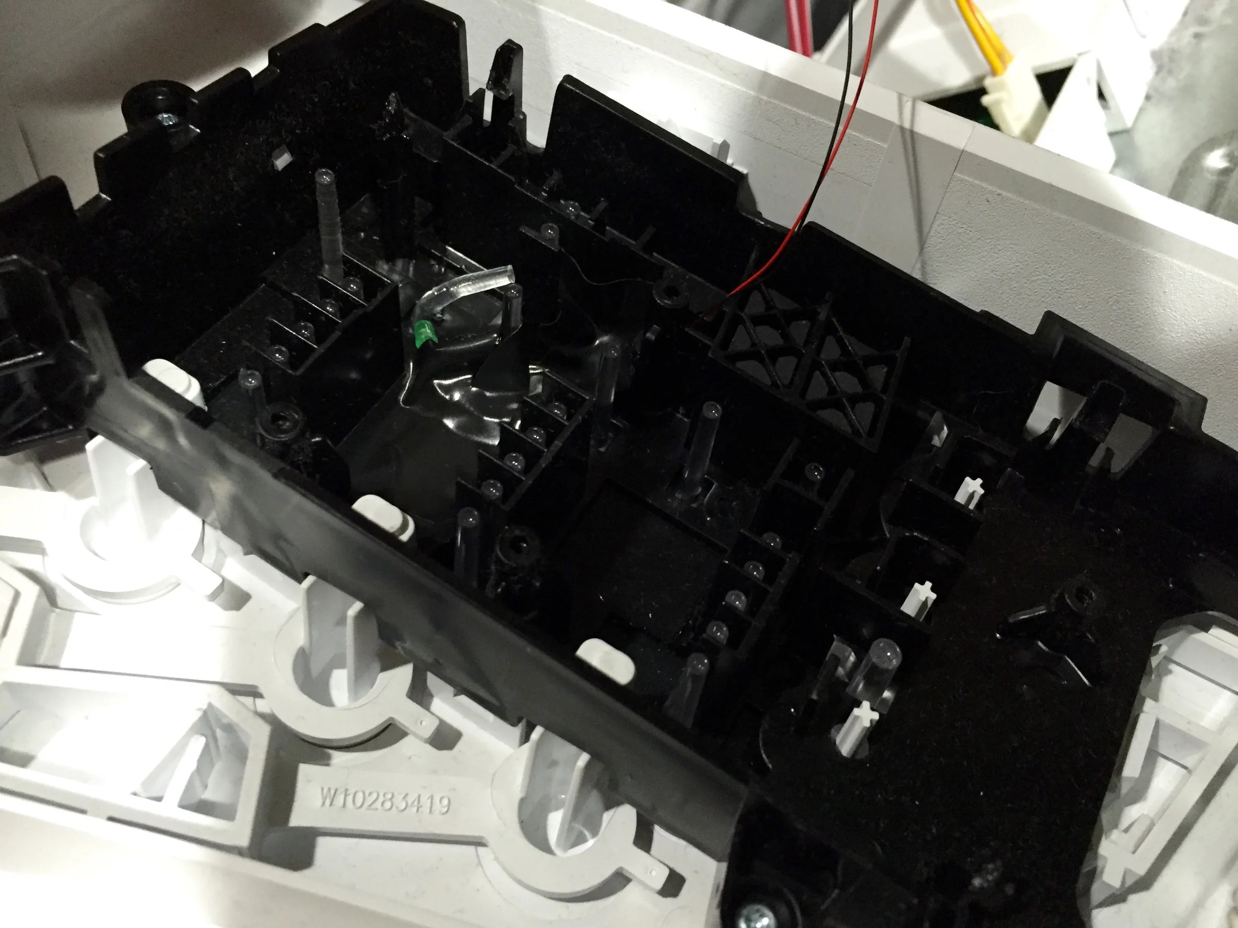 Original LED mounting, with it tapped down next to where the original acrylic post resided.