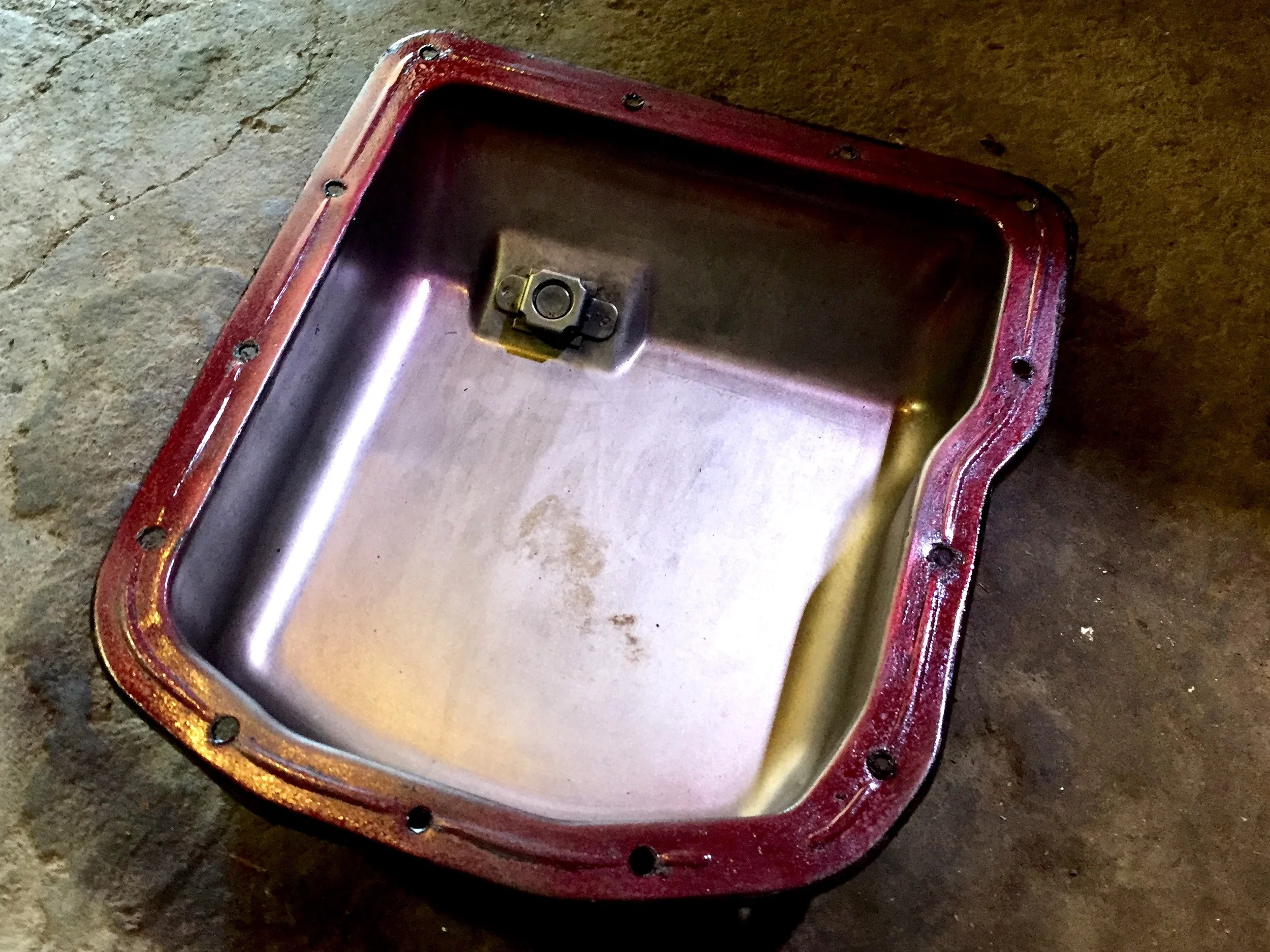 Spray sealant applied to the pan. The gasket was placed on top of it after letting it set up for a minute or so.