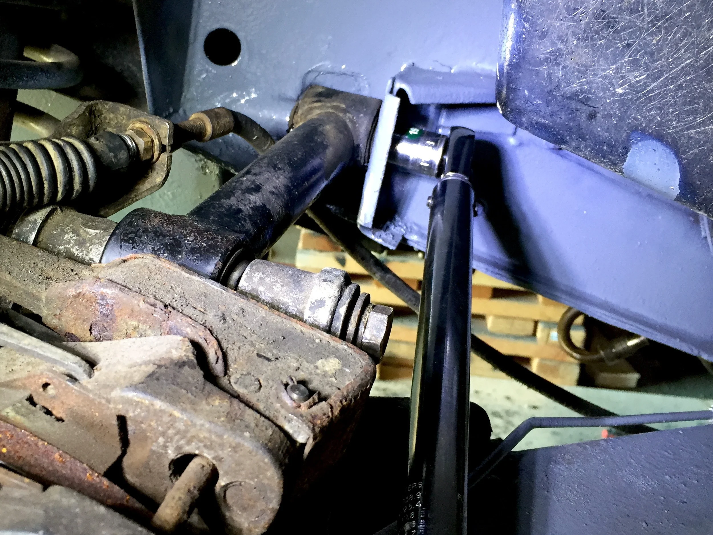 Torquing the inner link arm bolt. The outer bolt is already run through the arm and hub carrier and ready t one torqued.