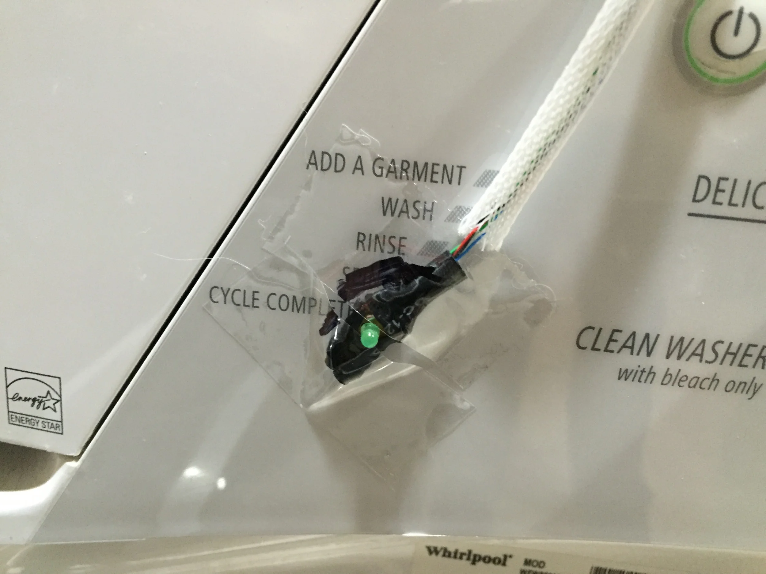 The poor job of mounting the washer sensor over the Cycle Complete LED. 