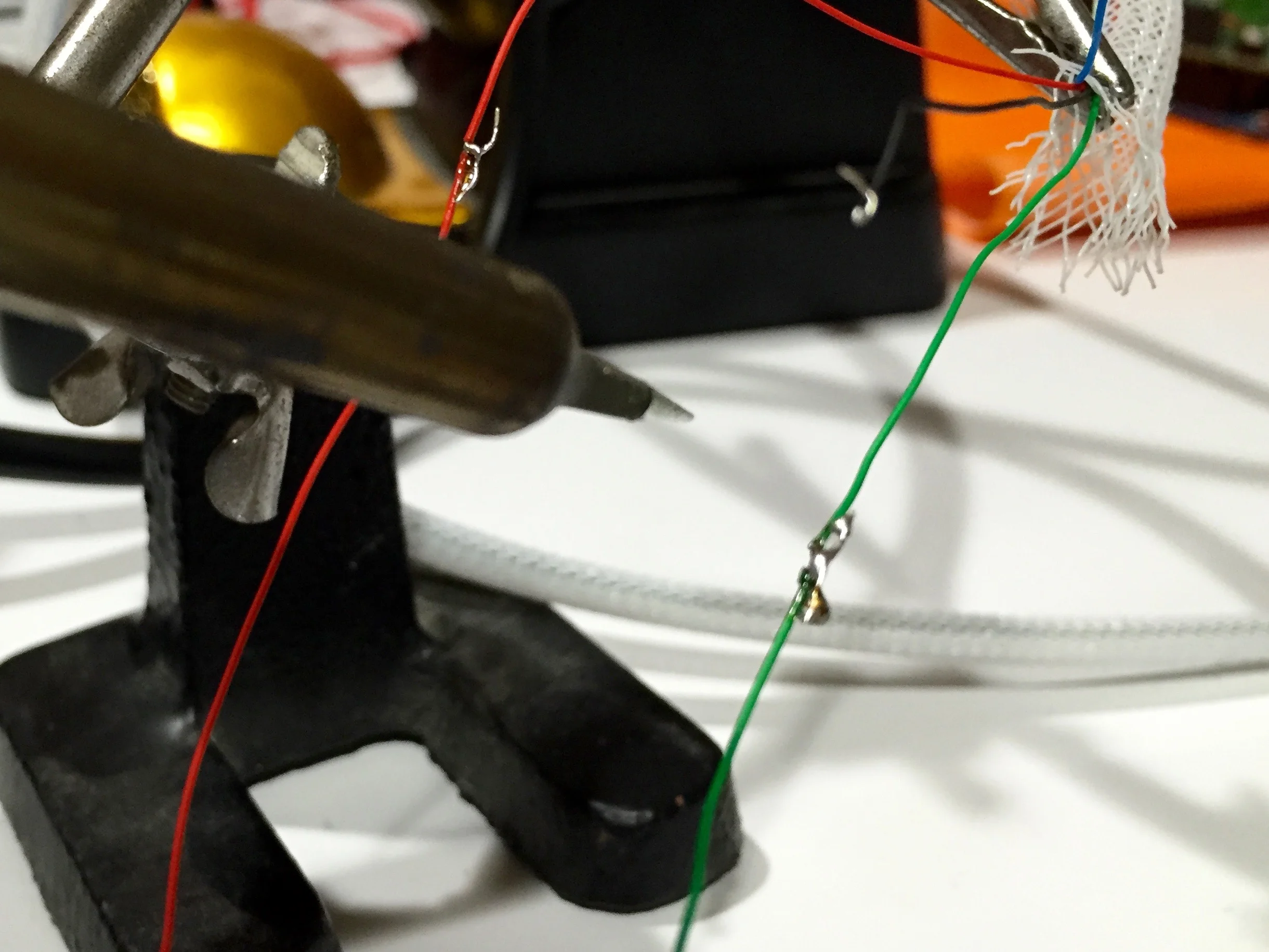 Extending the cable wires by soldering longer wires to them.