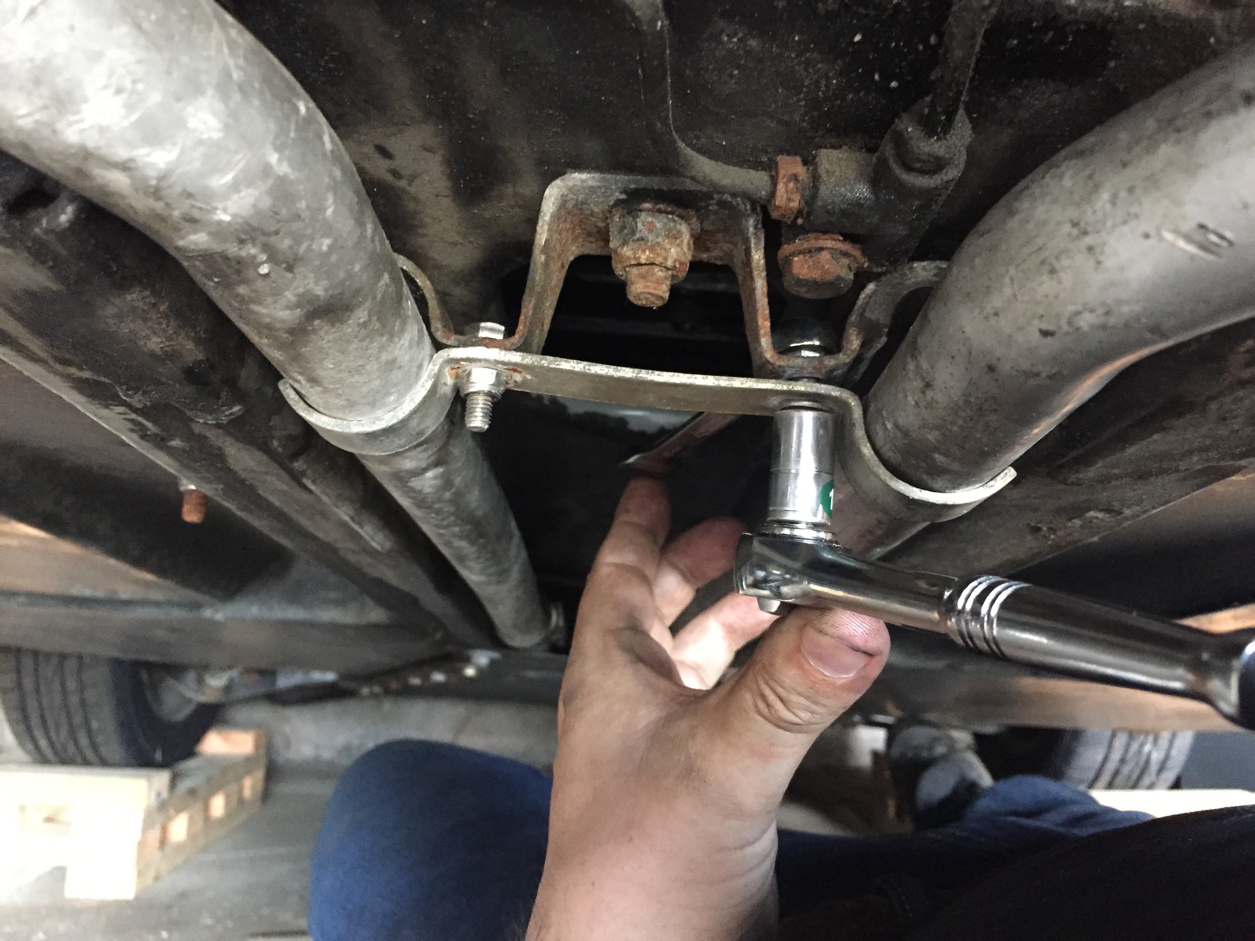 One final thing to do: tighten the brackets holding the coolant lines ahead of the transmission with a 11mm socket.