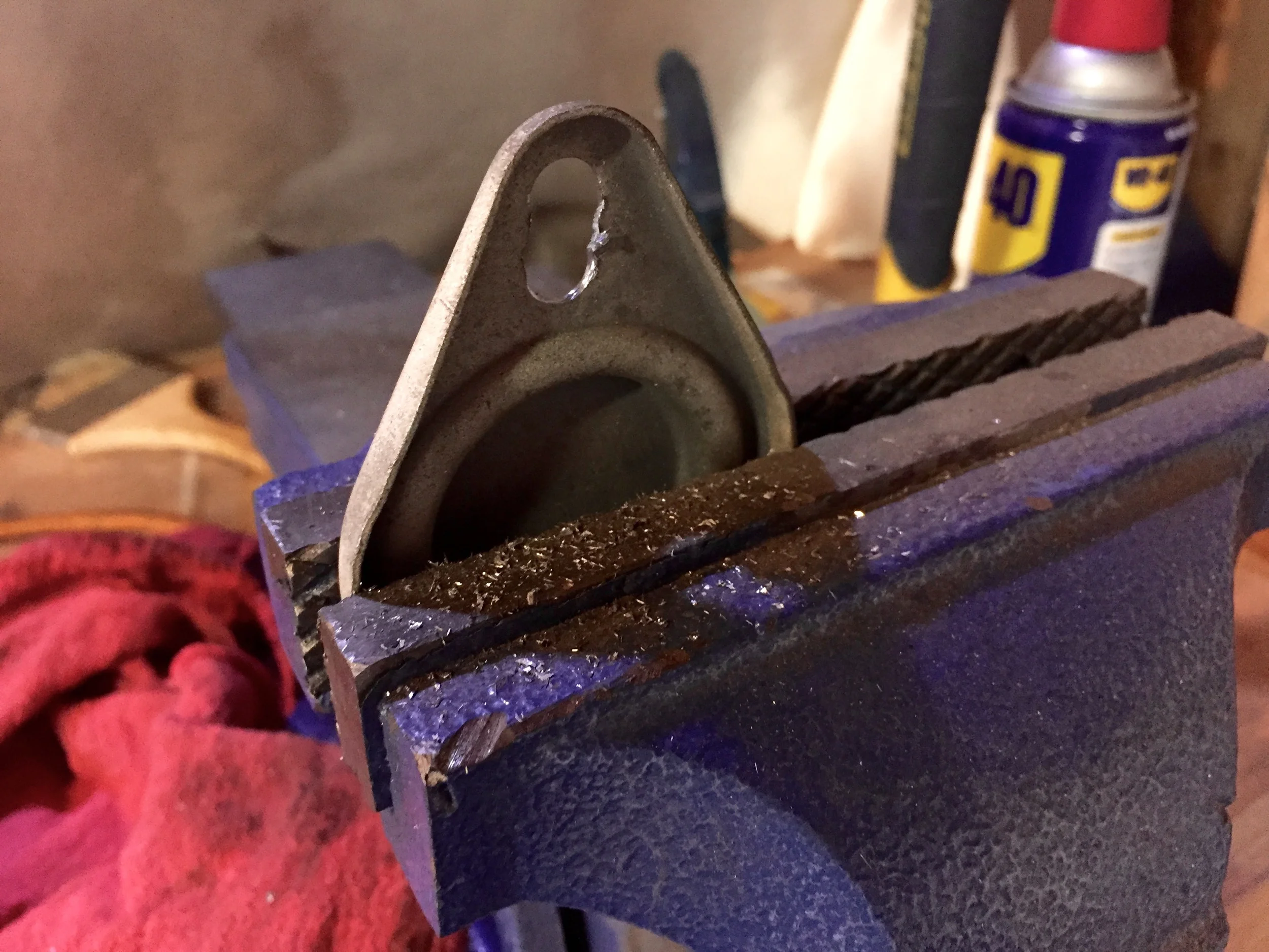 The extra hole drilled into the cap and joined with the original hole, creating a slot.