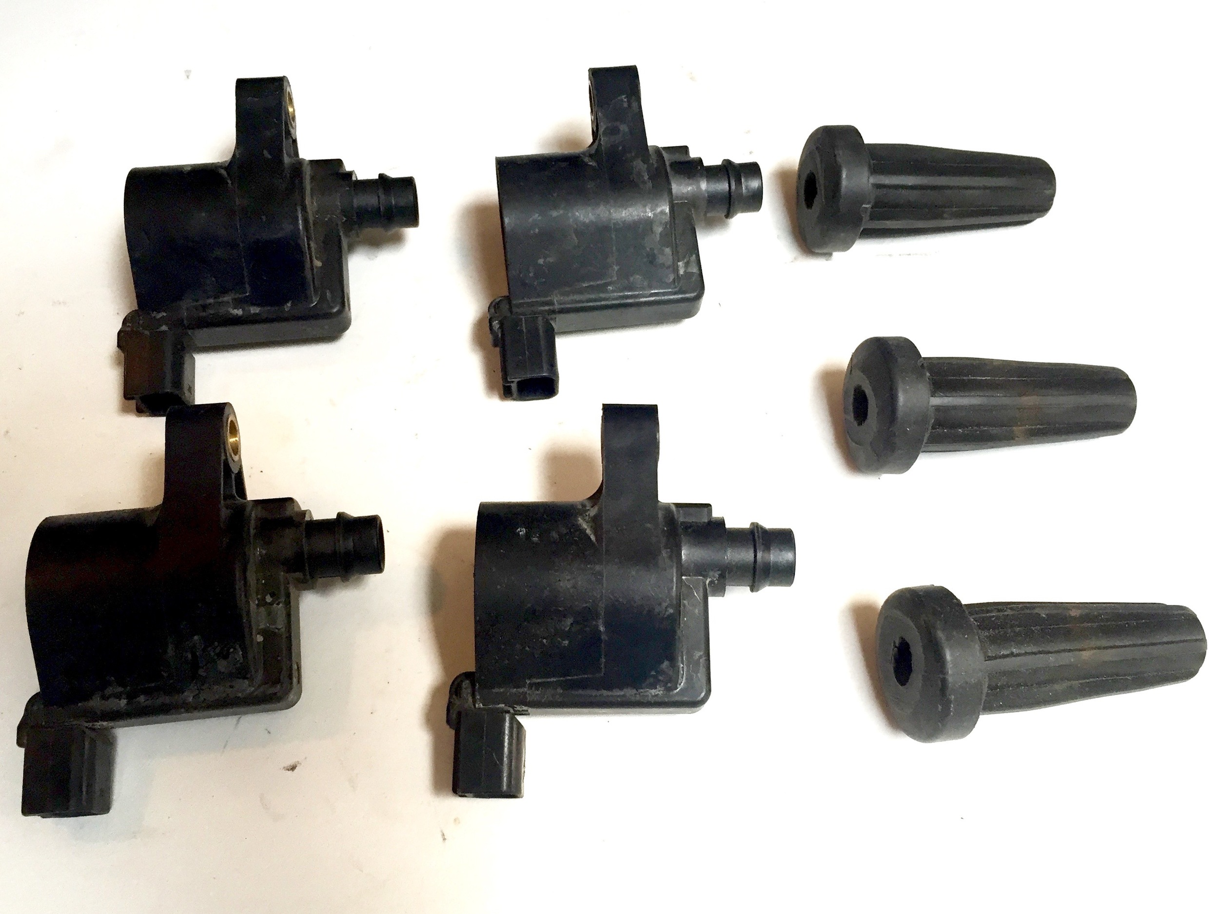 Four spare coils and two spare heads. This helps illustrate how the heads fit onto the coils. The conductive spring is not shown.