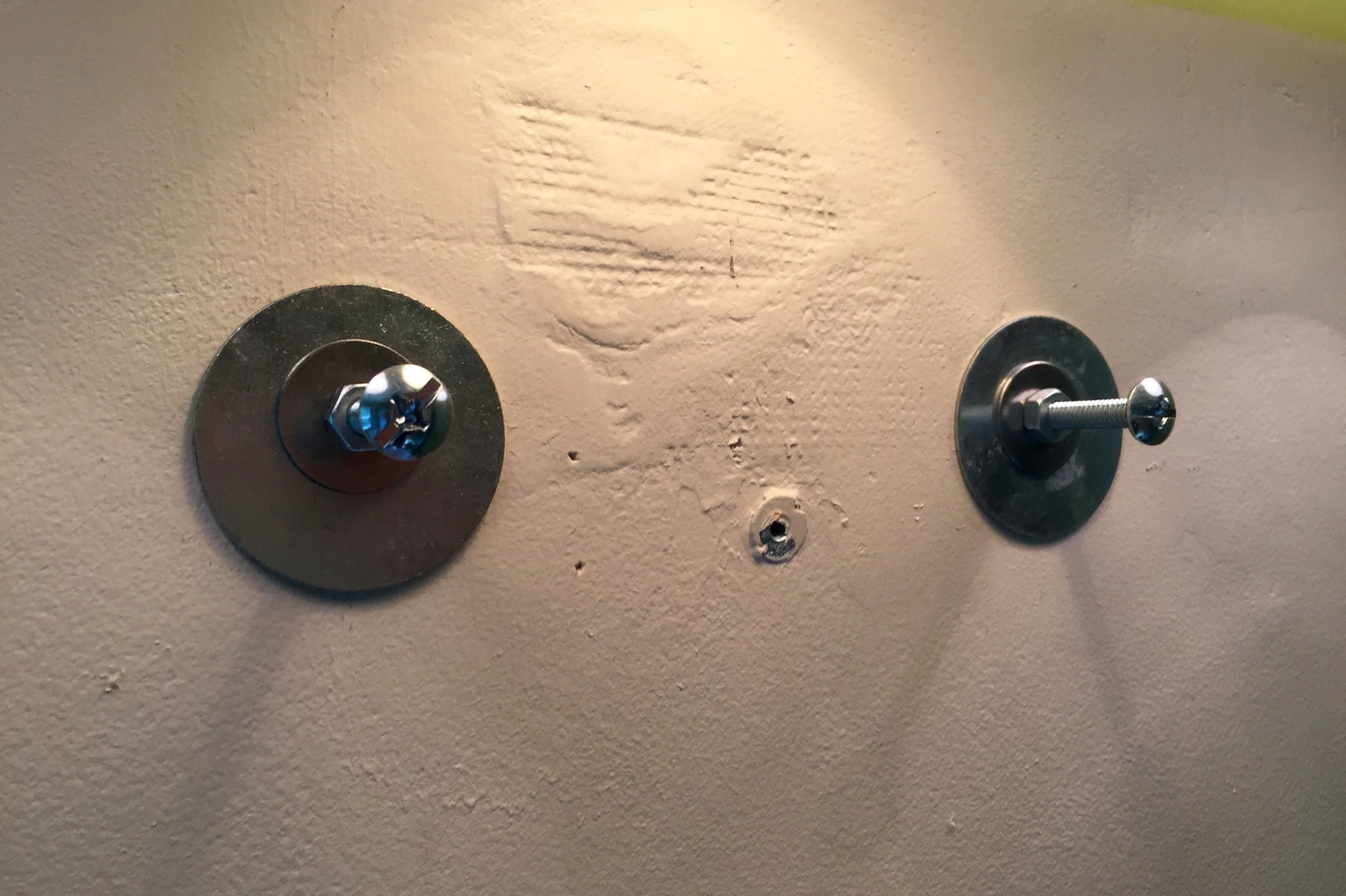 The anchors mounted in the wall.