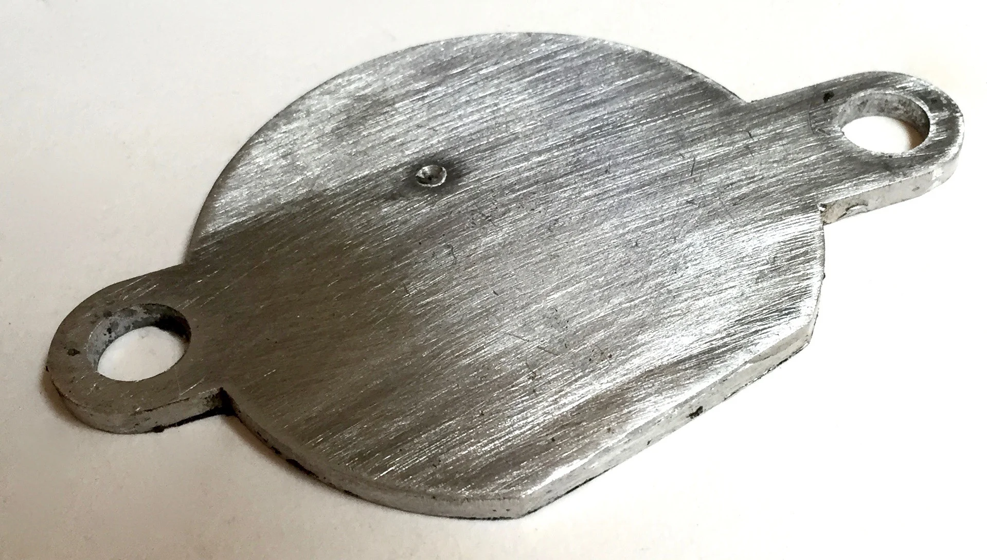 Cover for hole in the cylinder head where the distributor was mounted.