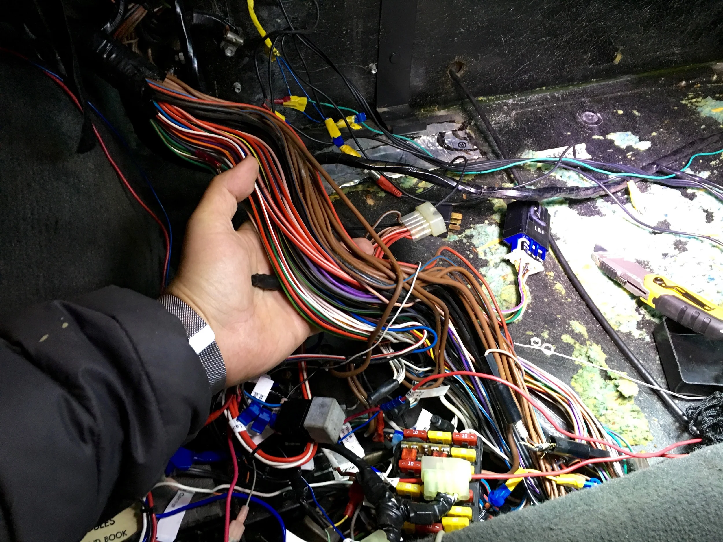 The main harness in the relay compartment after unwrapping.
