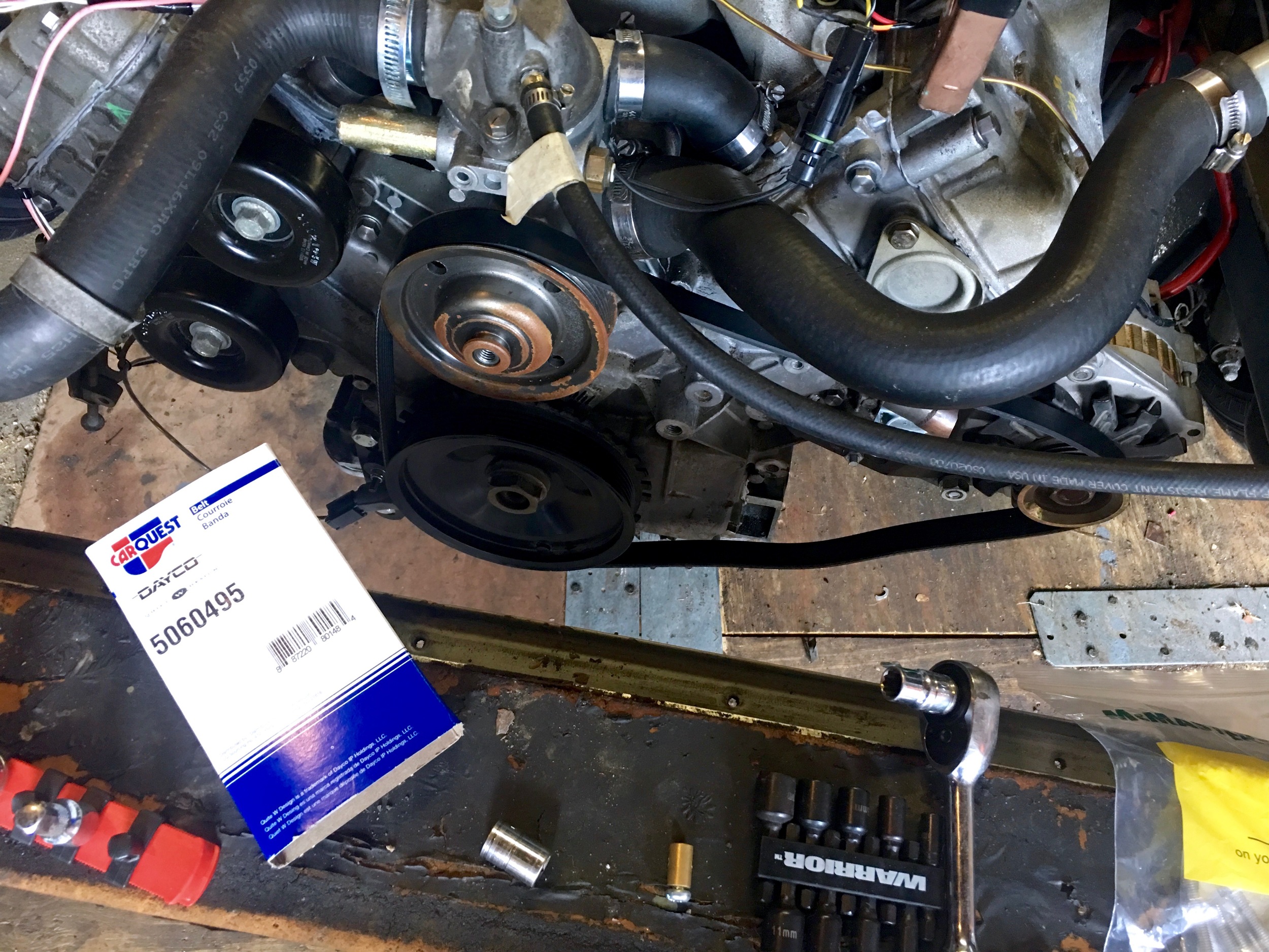 The CarQuest 5060495 belt wrapped around the crank, water pump and alternator pulleys. By the way, that's a new water pump -- the rust is just from a few months of sitting in my garage.