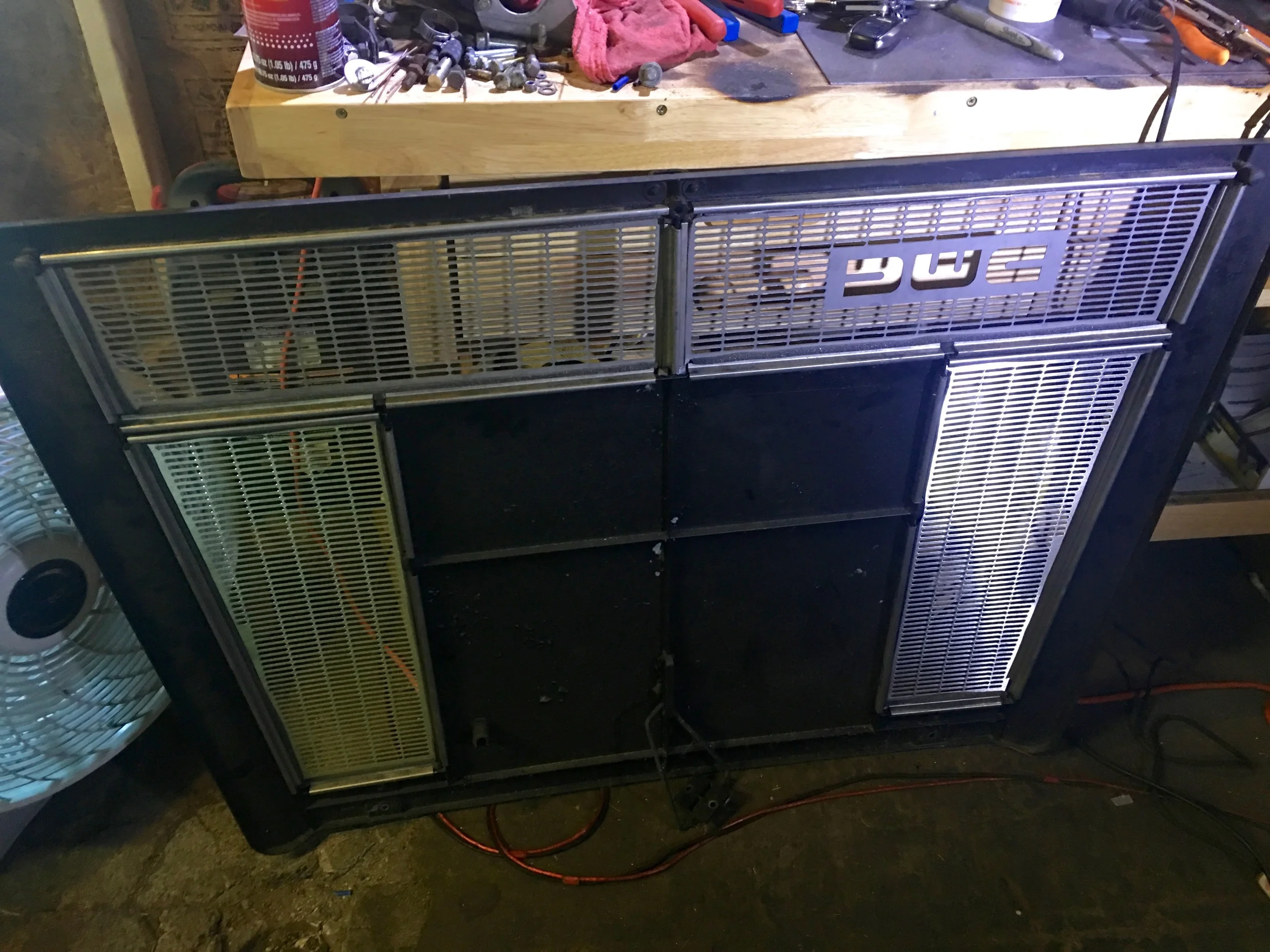 The final install of the grills and strips, as seen from the underside of the cover.