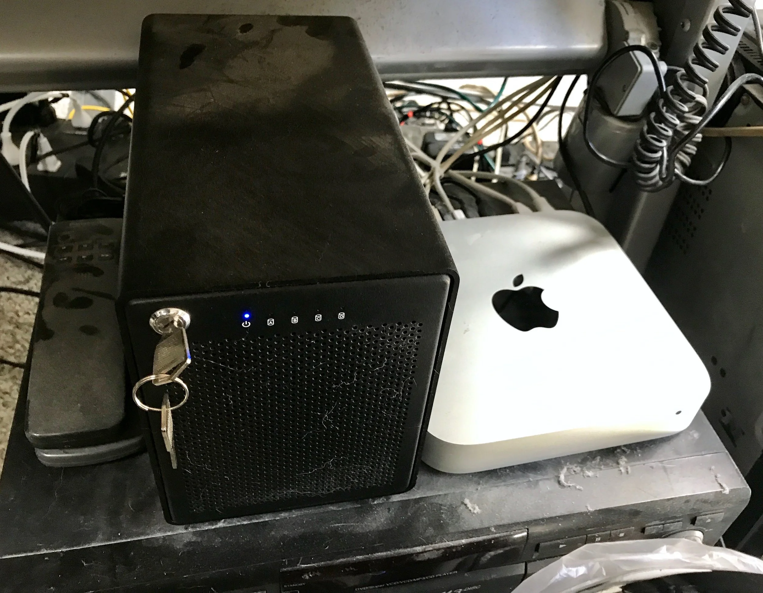 Mac mini and the OWC Thunderbay IV quad drive enclosure with larger drives that replaced the four older enclosures.
