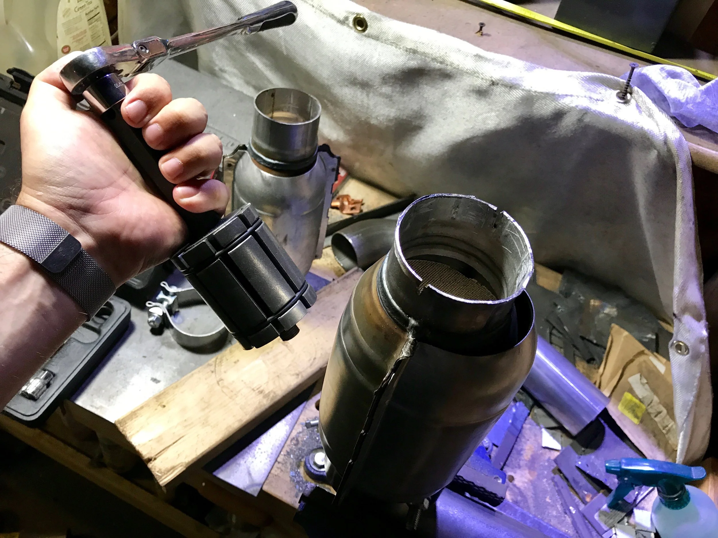 Getting ready to use the pipe expander to fix the slightly crushed end of the cat.