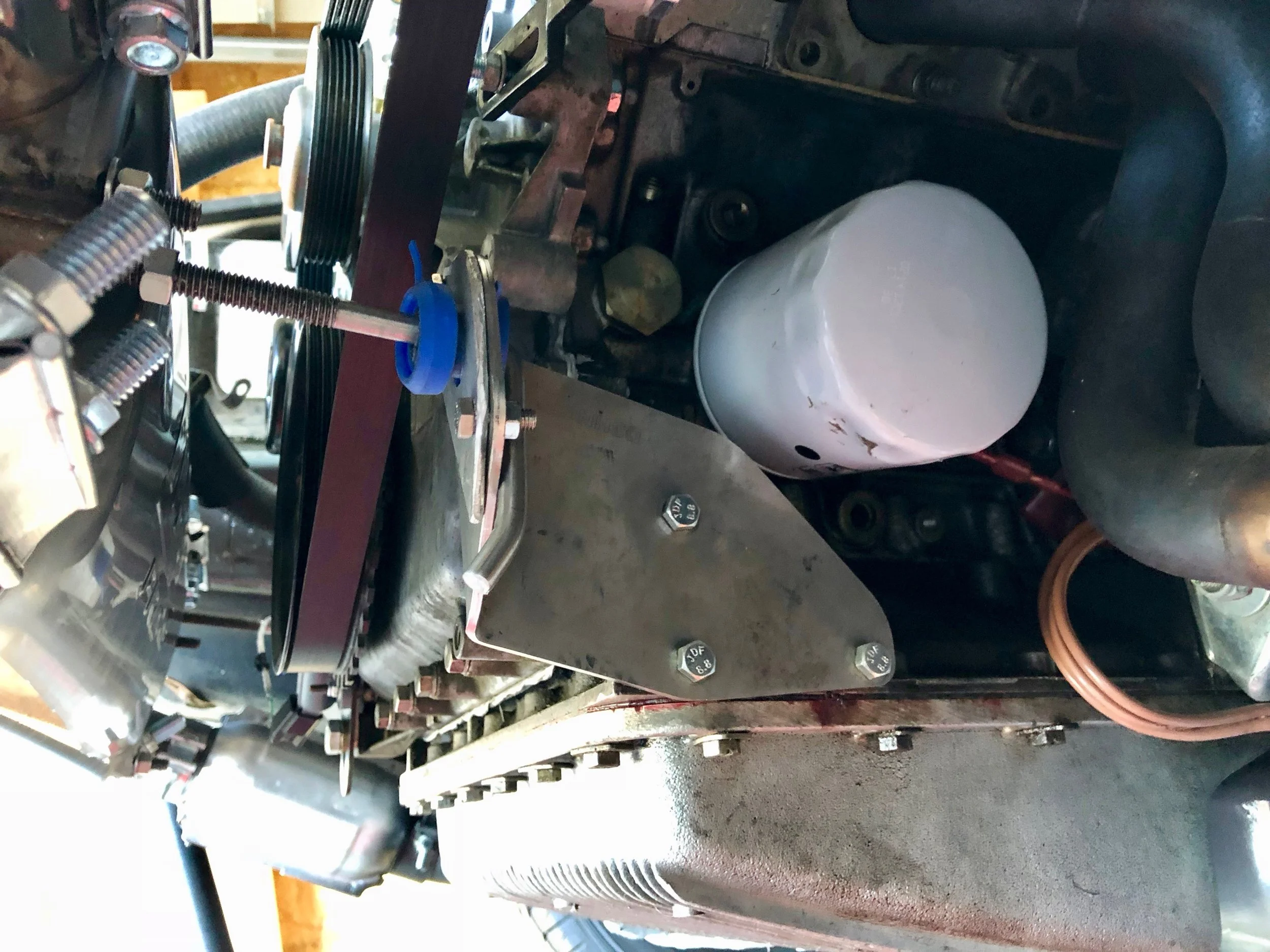 The passenger side bracket from DPI, with a custom aluminum mount holding the silicone insert.