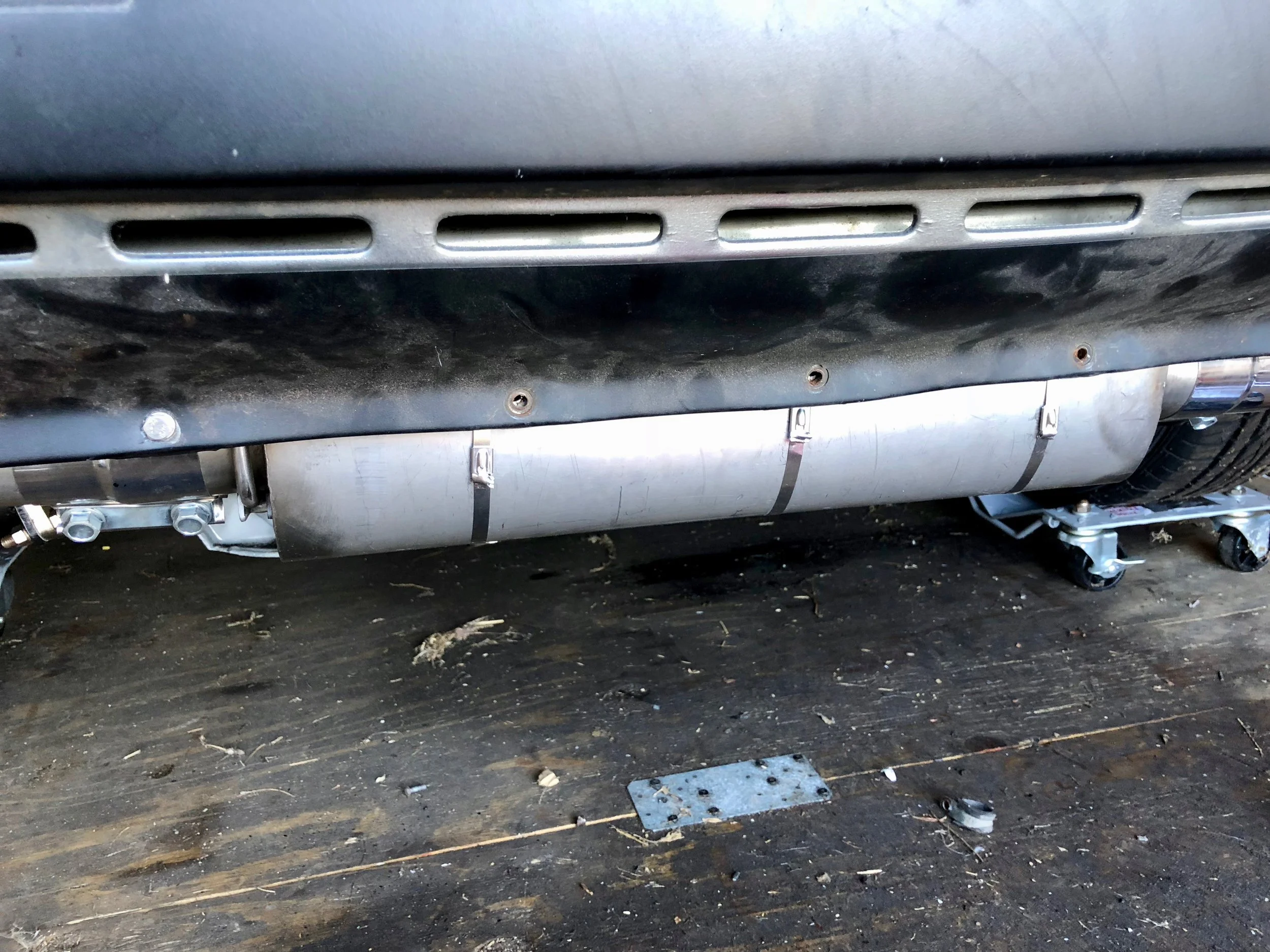 Metal ties holding the armor to the muffler. I'm not too concerned with them being visible.