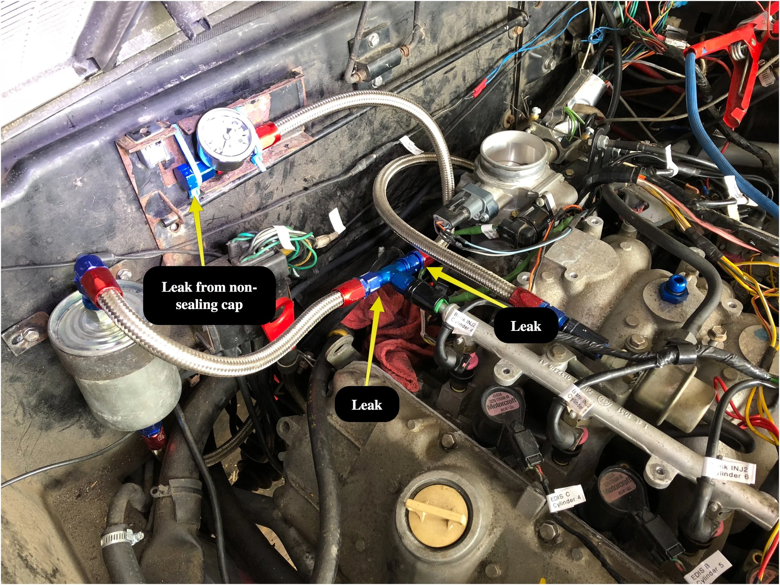Failed attempt at relocating the fuel pressure gauge, and all the leaks that occurred.