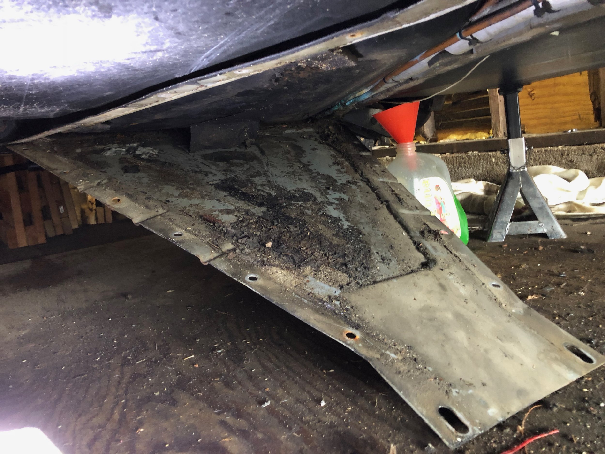 This is as much as I could drop the shield, due to the broken bolts along the front. This shield collects a lot of debris as well.