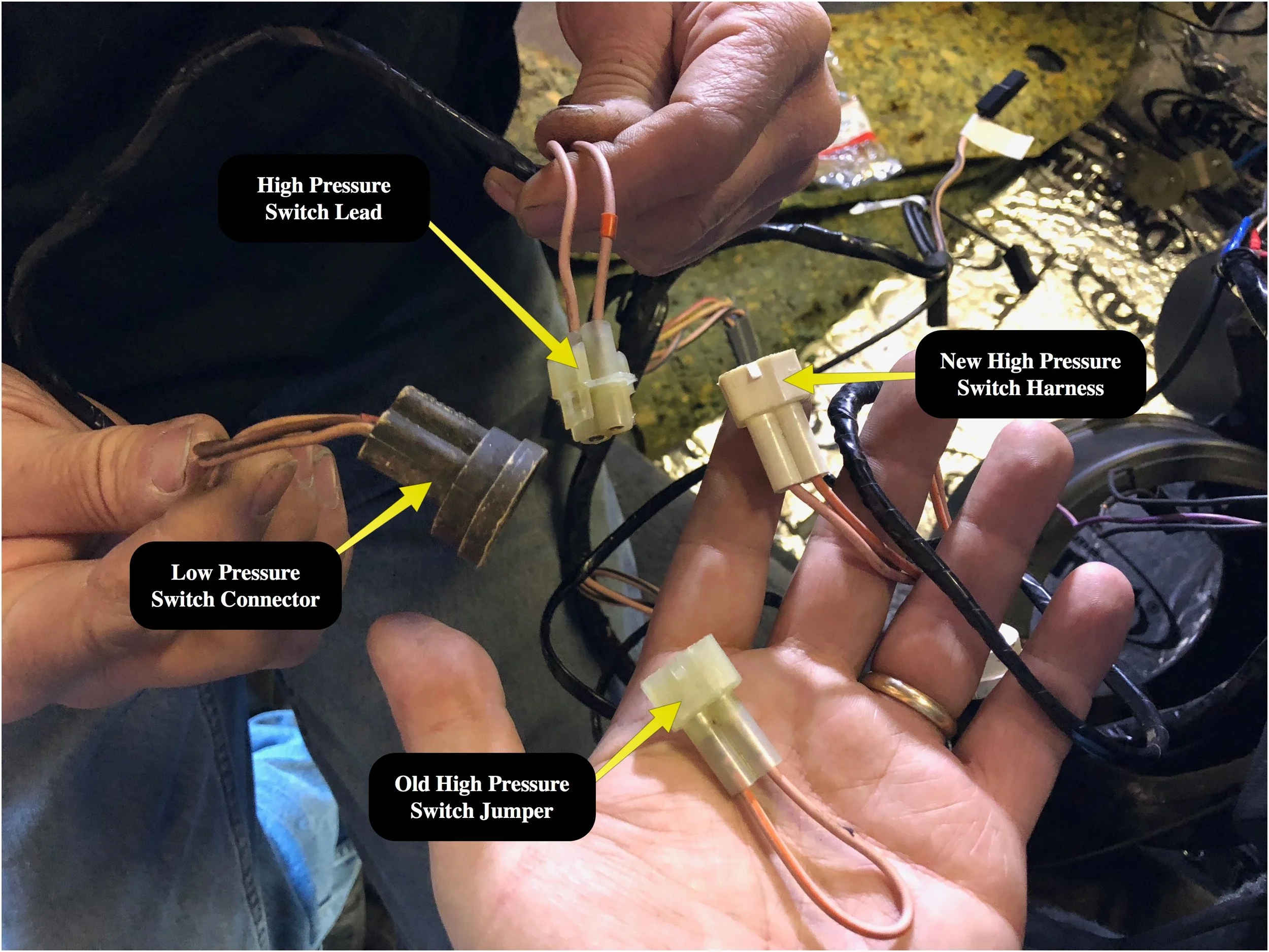 The low pressure switch connector is built into the harness. The high pressure switch connects to a plug, which replaces a jumper present in the early VINs.