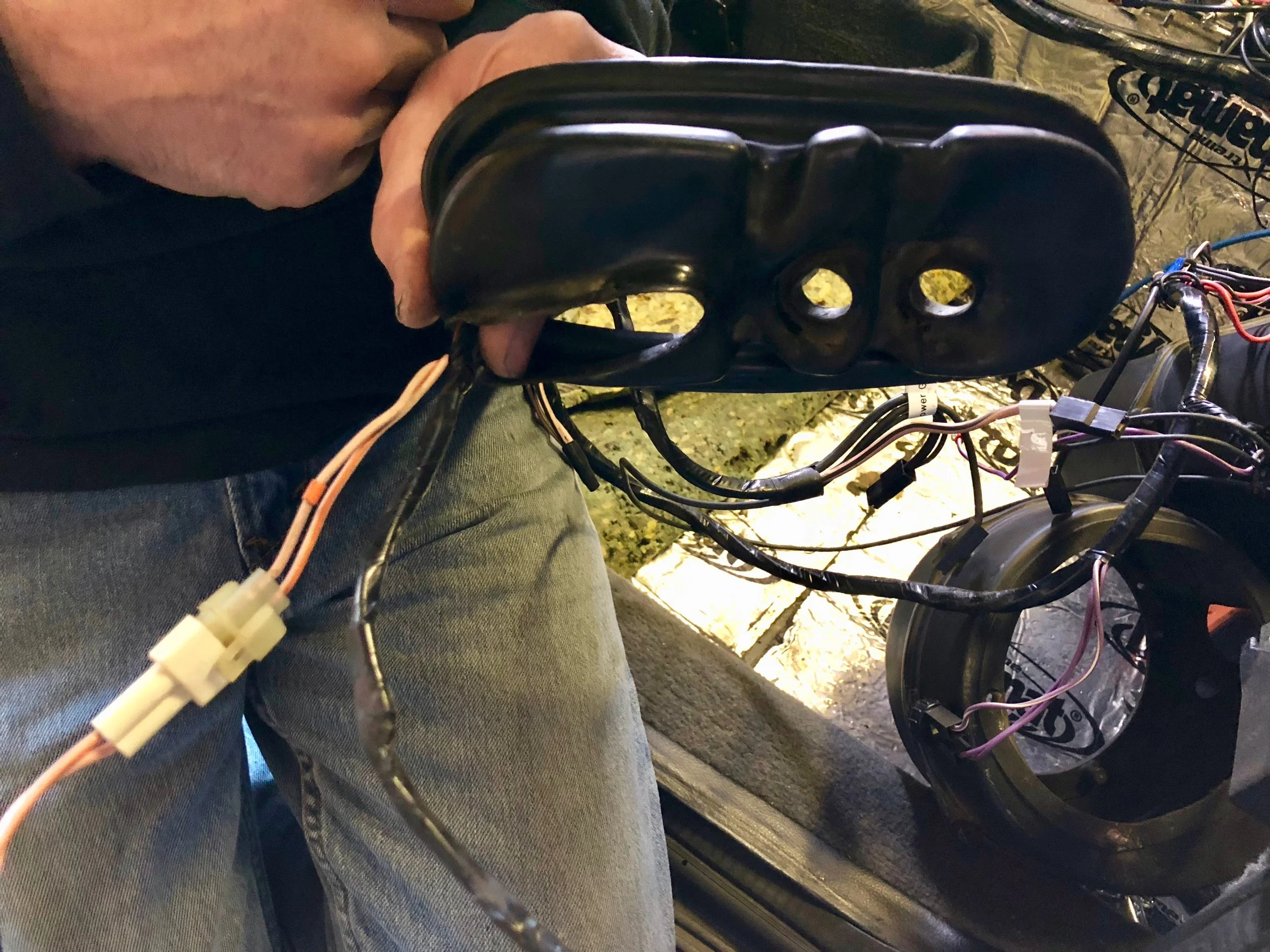 The rubber boot that the pipes and wires go through. The wires go through the left side of the boot as shown here.
