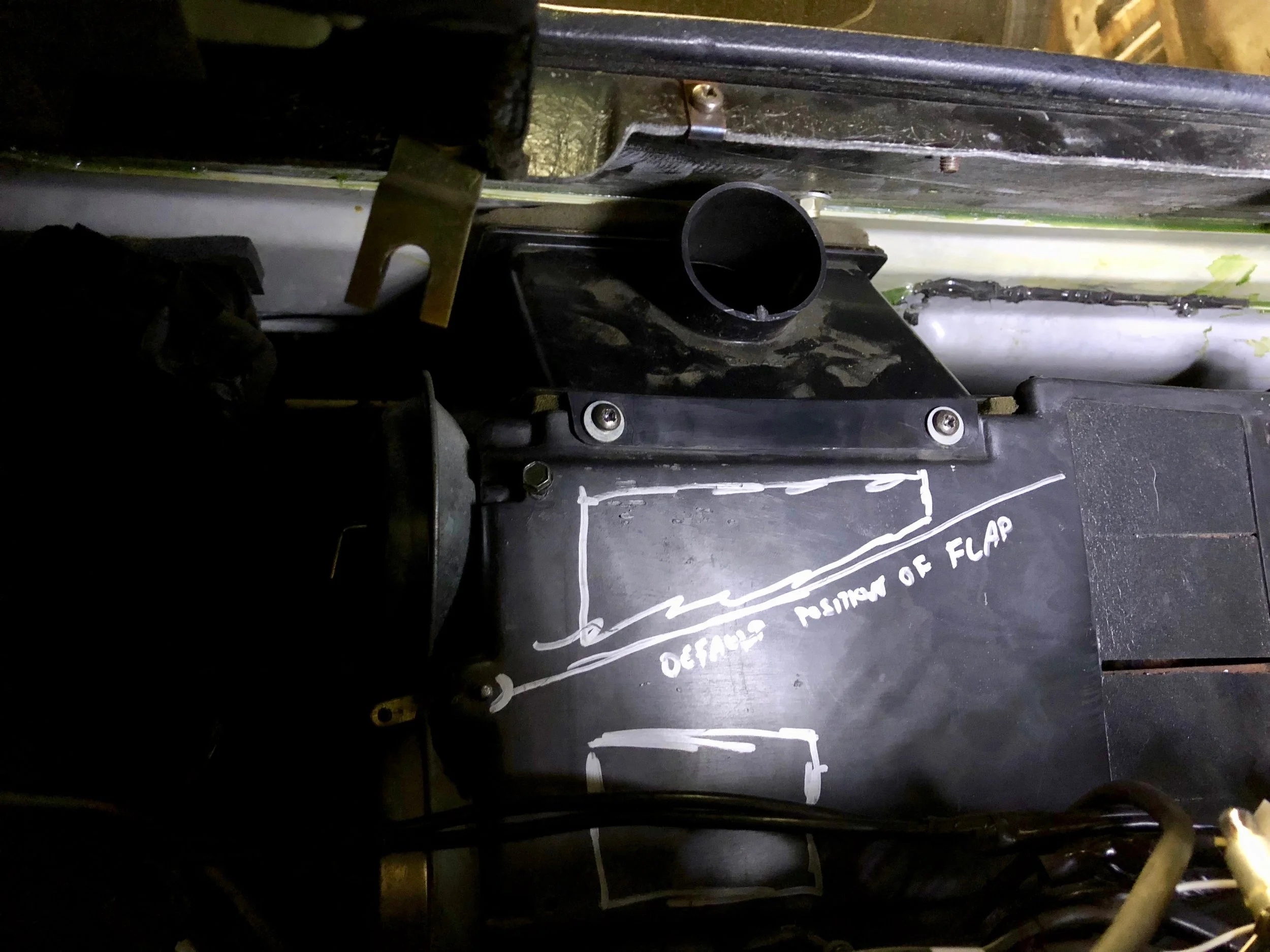 The defrost duct installed on the top of the box. The air destructor is removed from this picture, but you don't need to remove it to install or remove the duct.