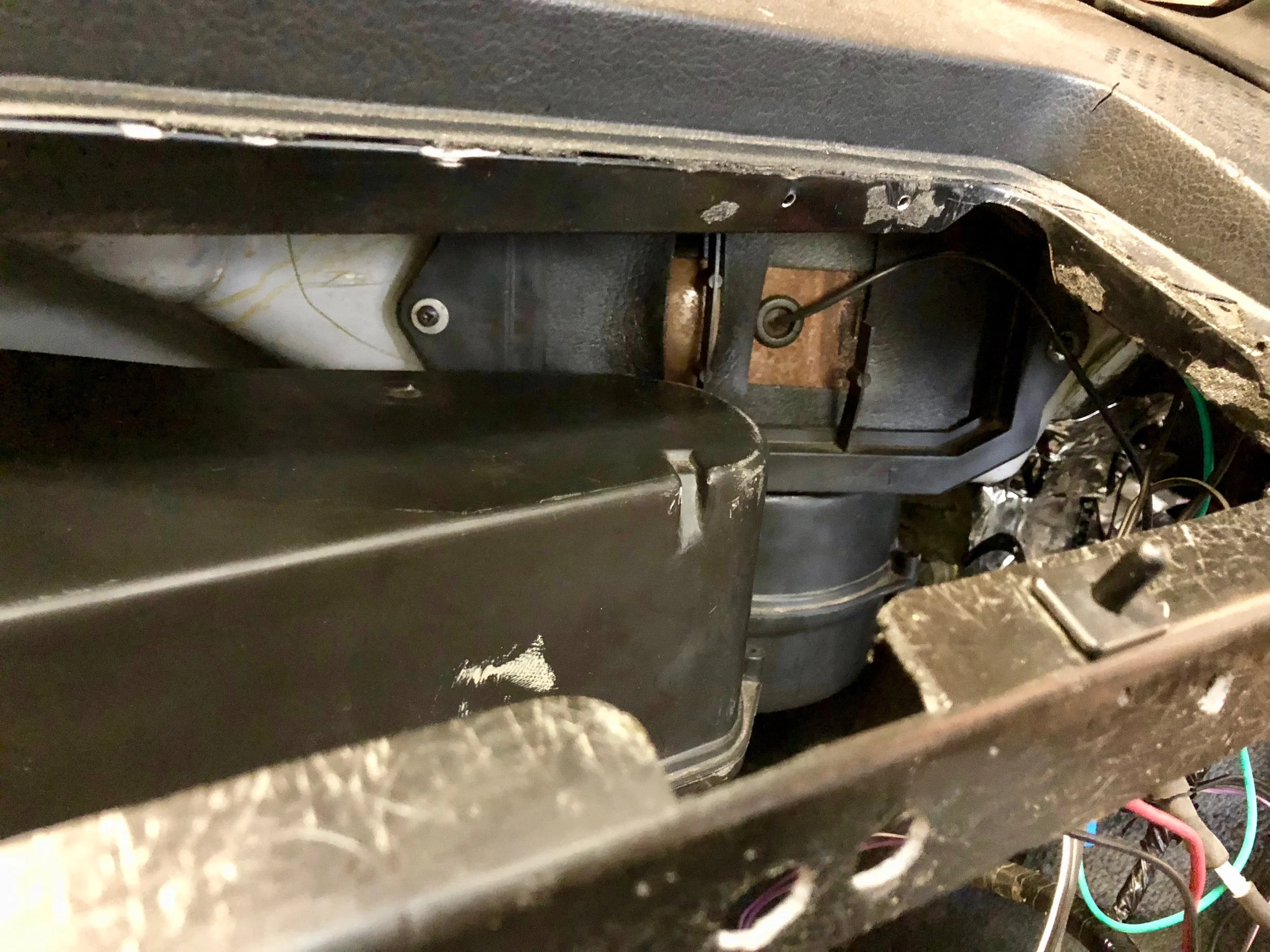 The newly-foamed recirculation vent re-installed above the blower motor.