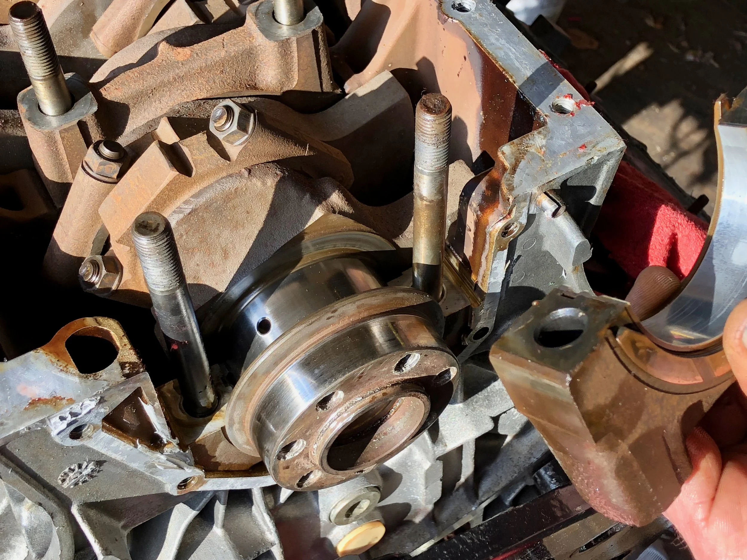 The rearmost carrier removed. Marks can be seen on the bearing being held on the right of the frame, but the crank itself looks good.