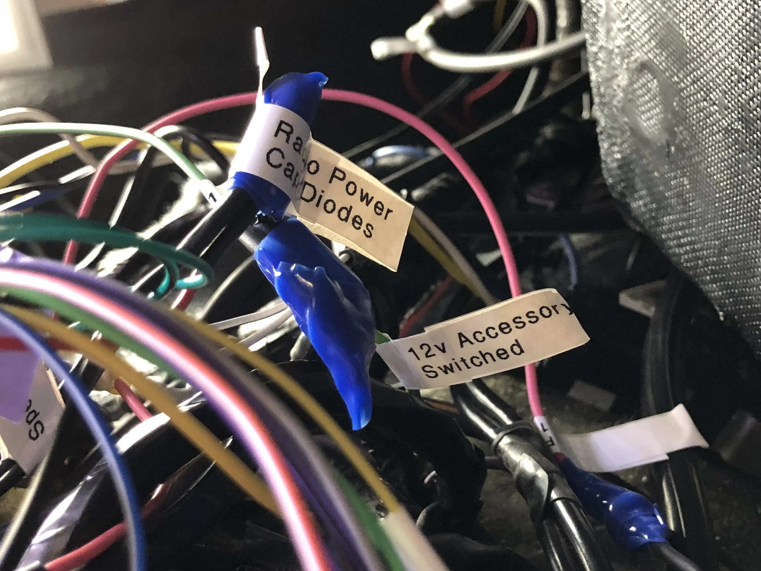 Everything connected behind the radio, wrapped in blue self-fusing tape.