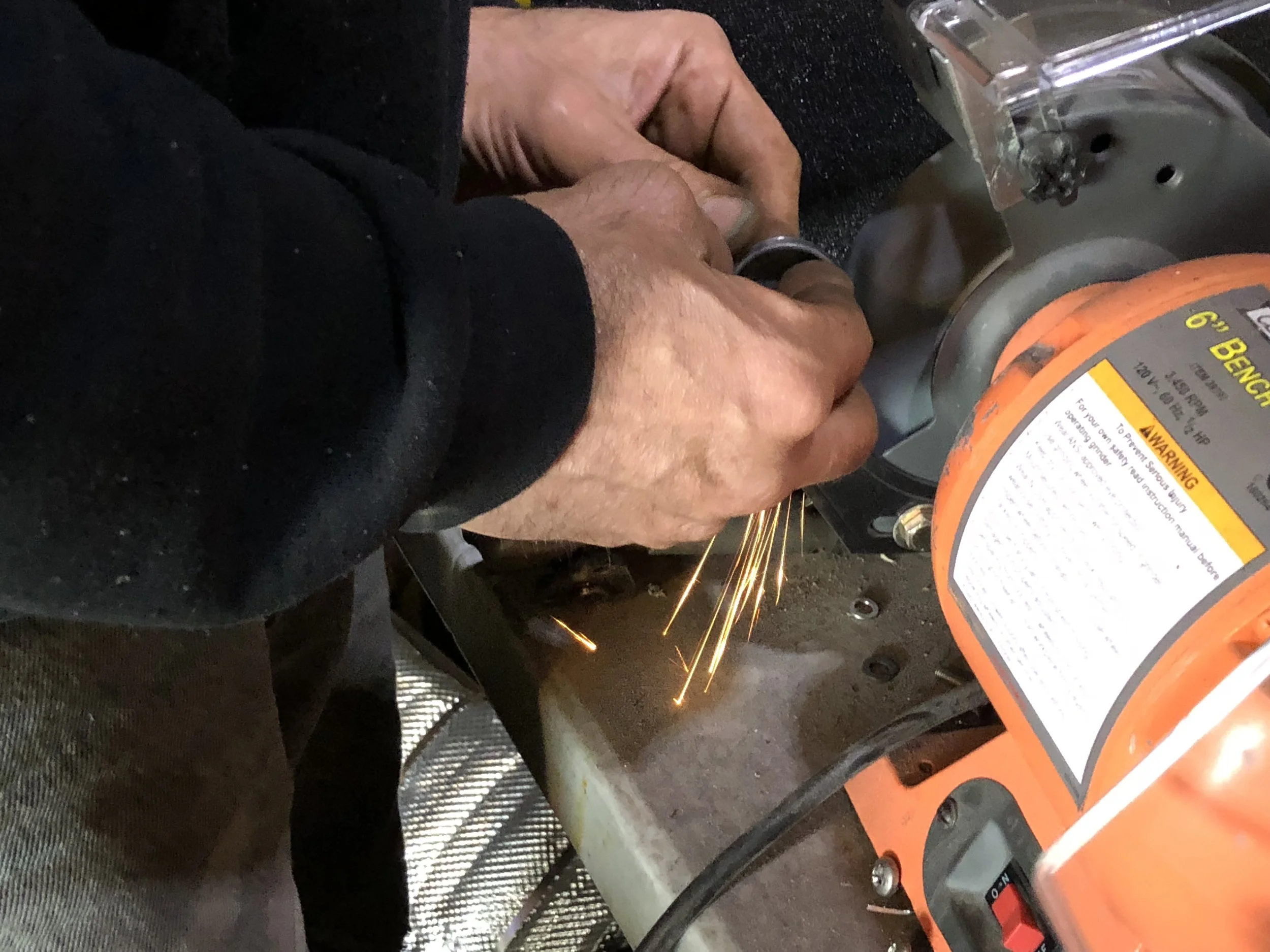 Grinding the slightly oversized plug down to fit the block.