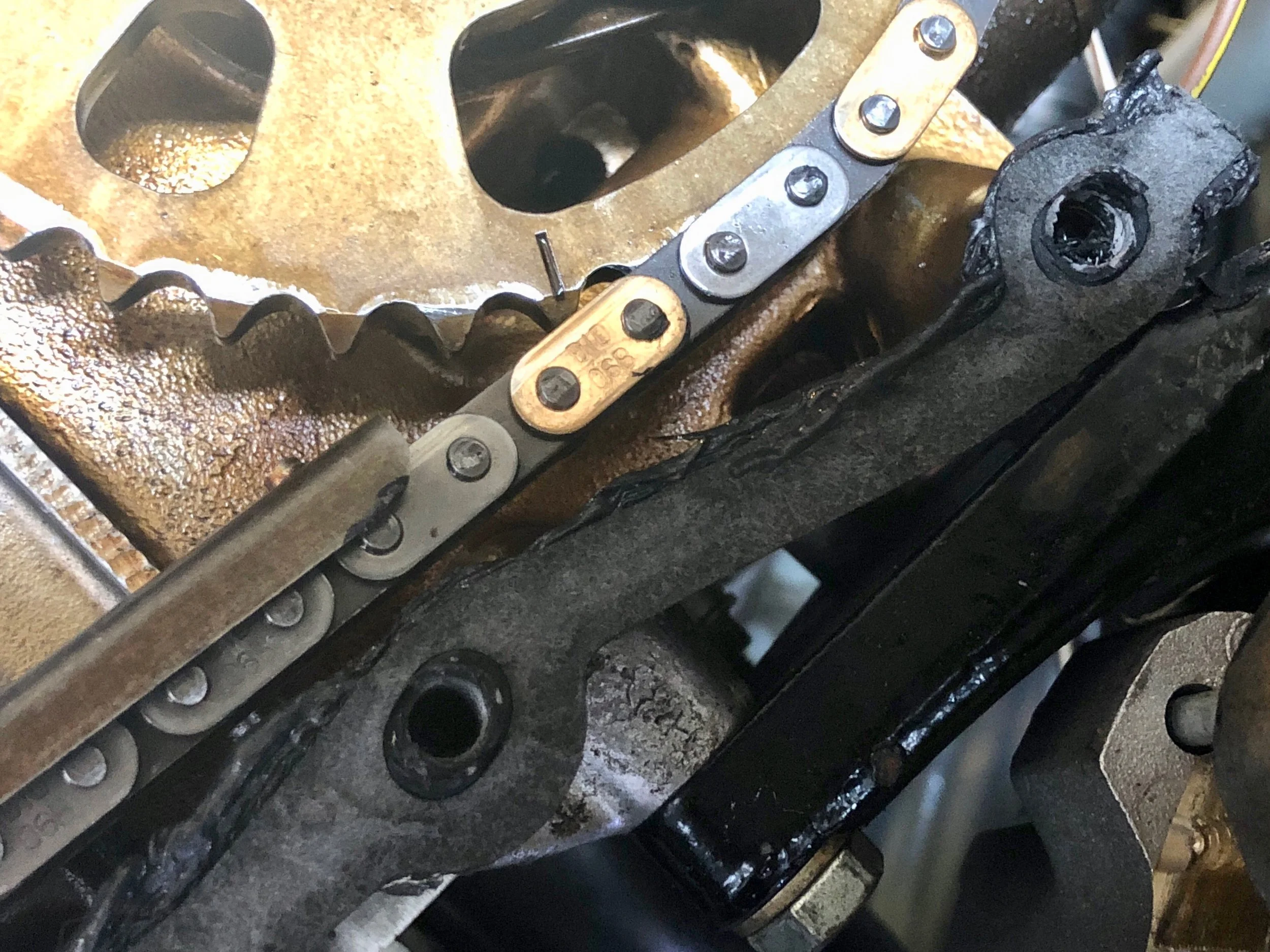 Some light scratches are visible on the timing chains. These are due to running the engine without oil, which caused them to scrape along the edges of the guides.