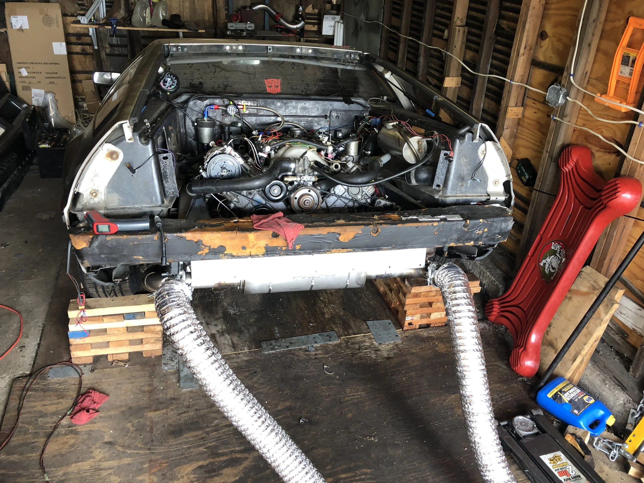 Dryer ducts connected to the exhaust pipes. Not perfect, but much better than not having them.