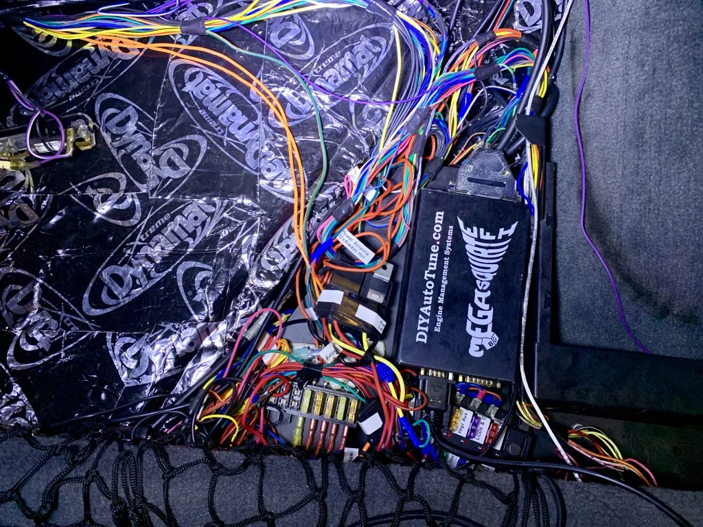 The ECU compartment behind the driver’s set, mostly neatened up.