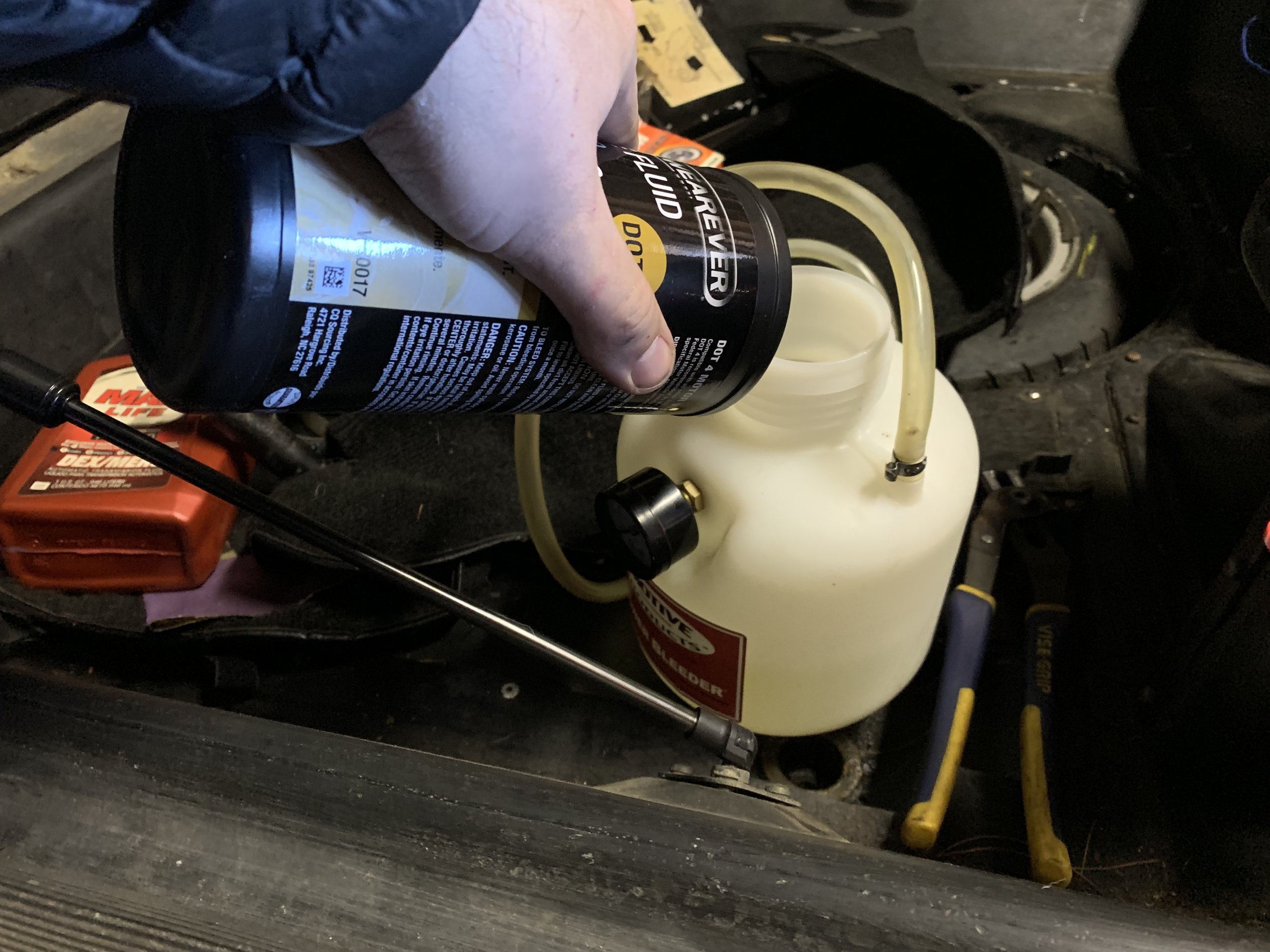 Filling the bleeder with its second quart of DOT 4.