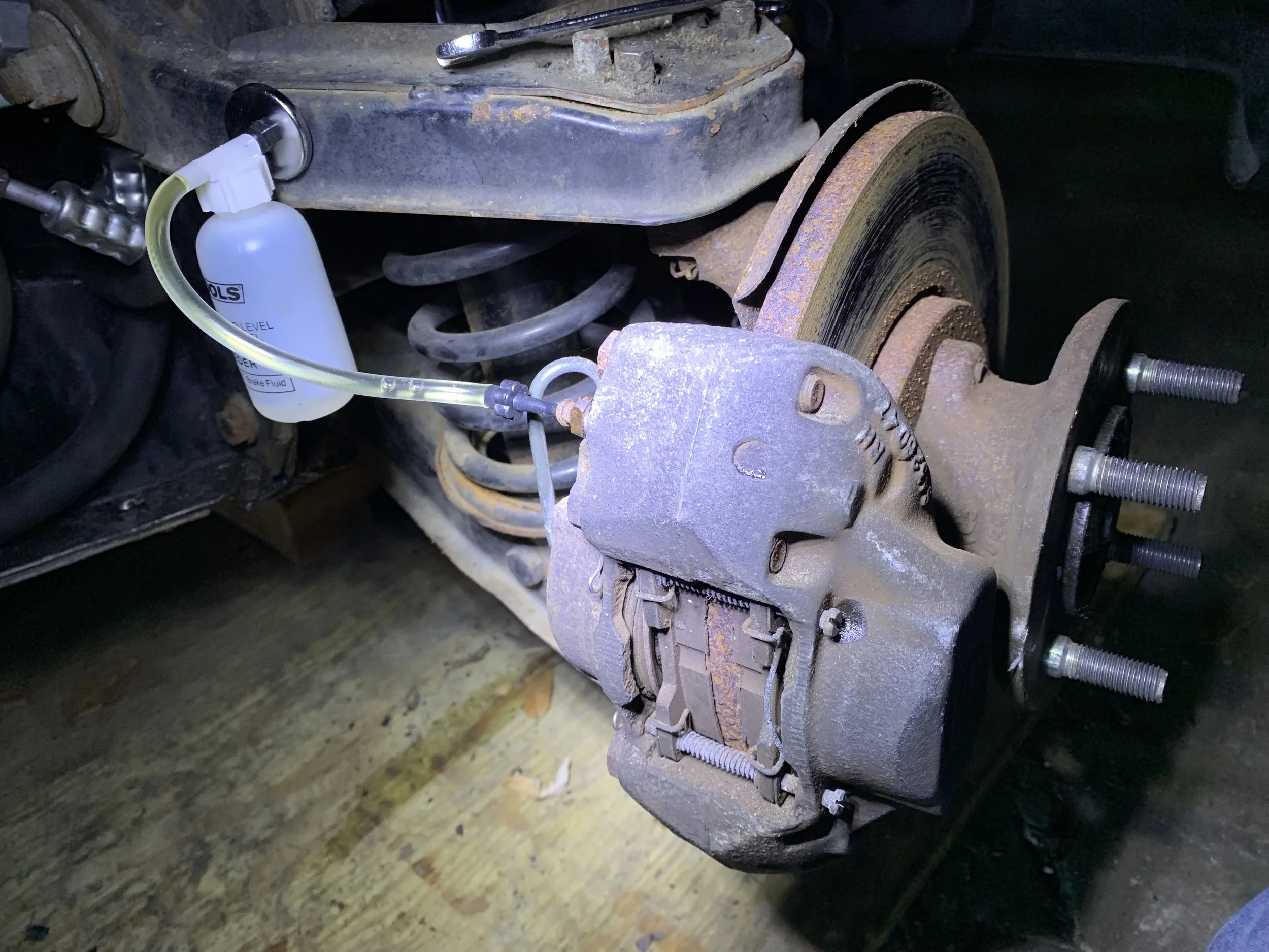 The bleed scree on the front calipers is on the inside.