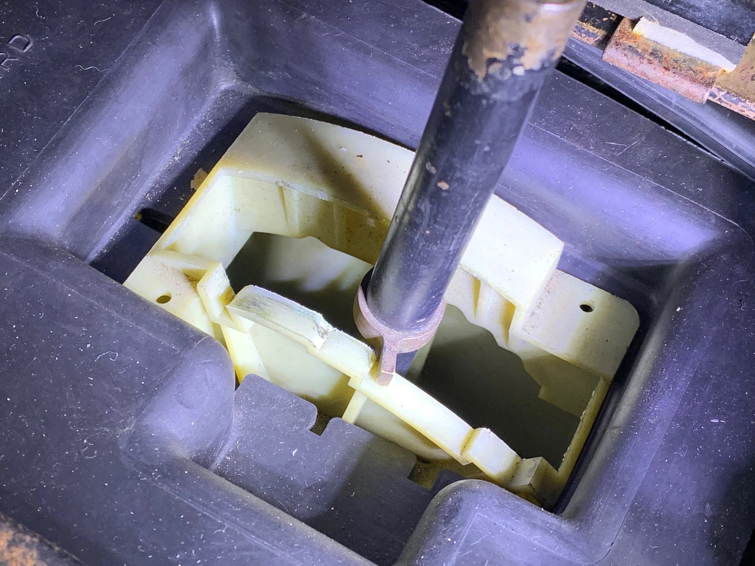The brass ring on the shifter, properly adjusted. I moved it out of the way (further up the shaft), since my return spring is missing.