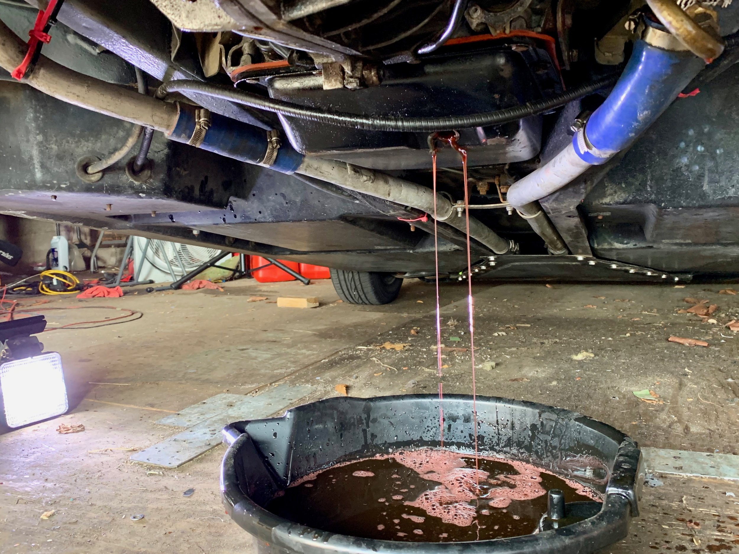 Draining the fluid.