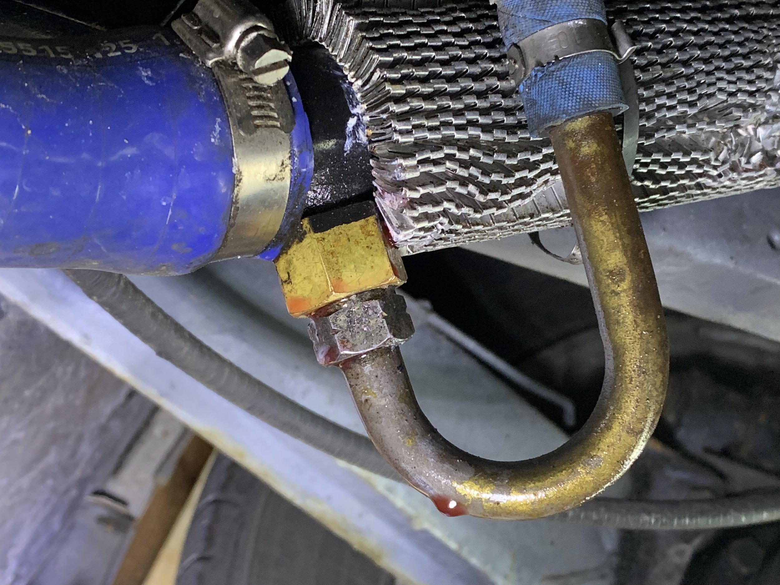 The leak at the transmission cooler nut. It was also leaking from the upper nut, running behind the heat sink and tripping off of the bottom nut. These were fixed by tightening both nuts further.
