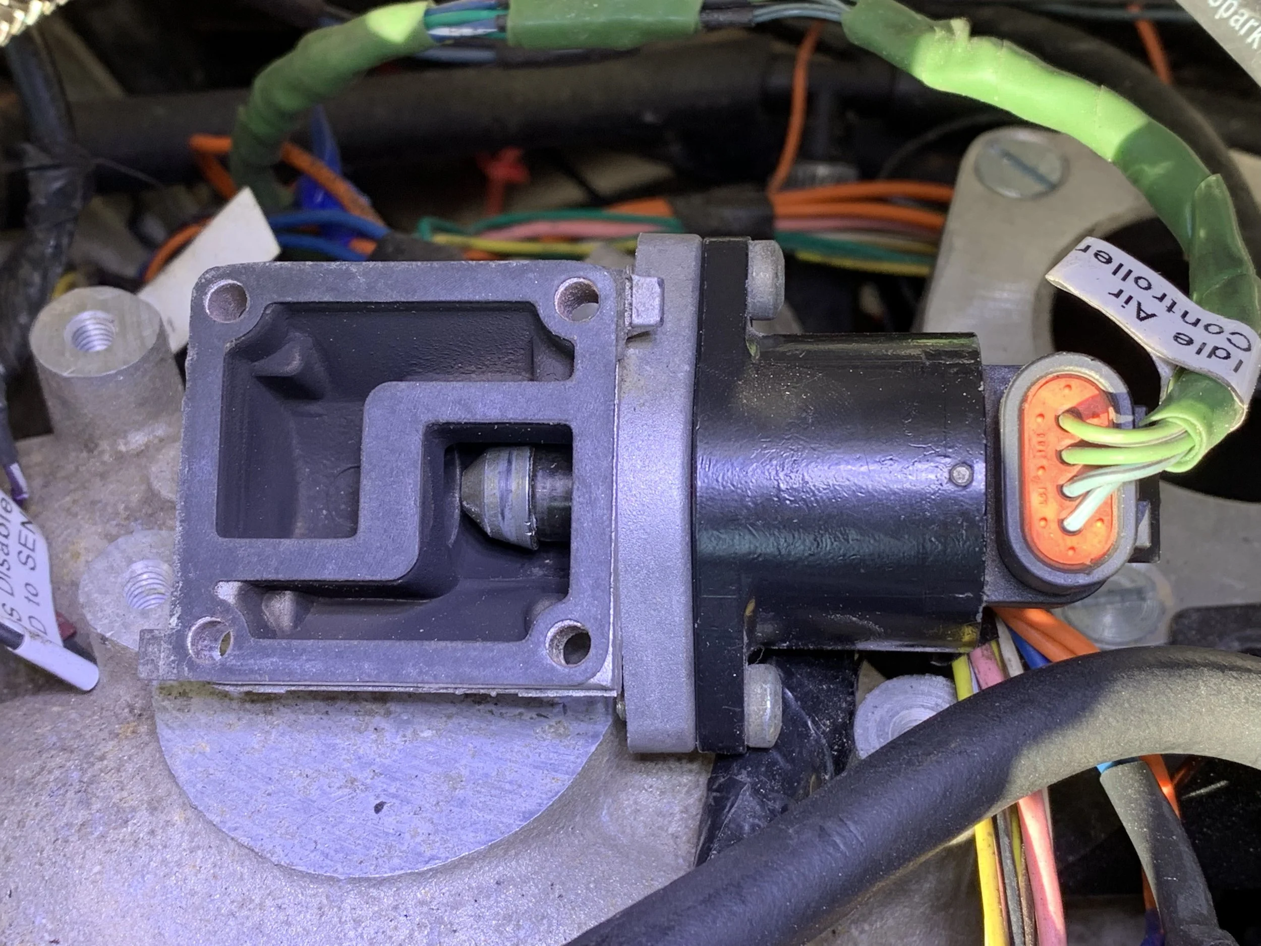 The IAC in the “run” position, allowing air through the bypass and into the engine.