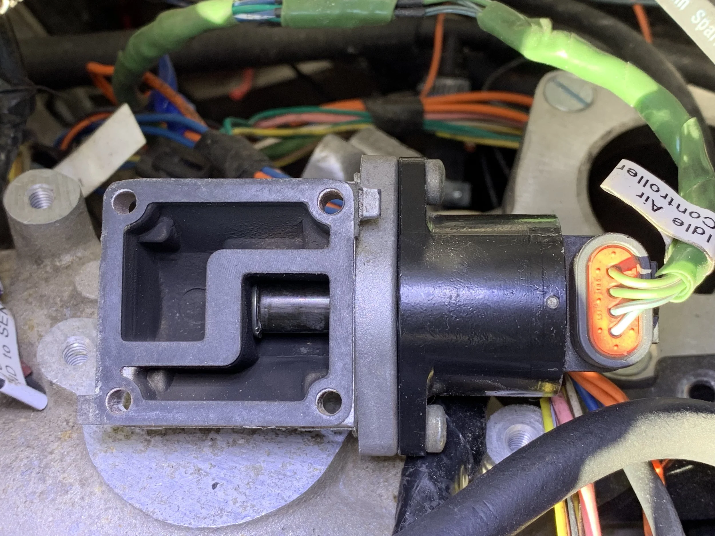 The IAC in the “home” position, completely sealing off the bypass. Note that you should set the number of home steps so that the motor is pushing too far into the hole so that it is guaranteed to find home, as opposed to trying to find the number of steps that exactly seals it.