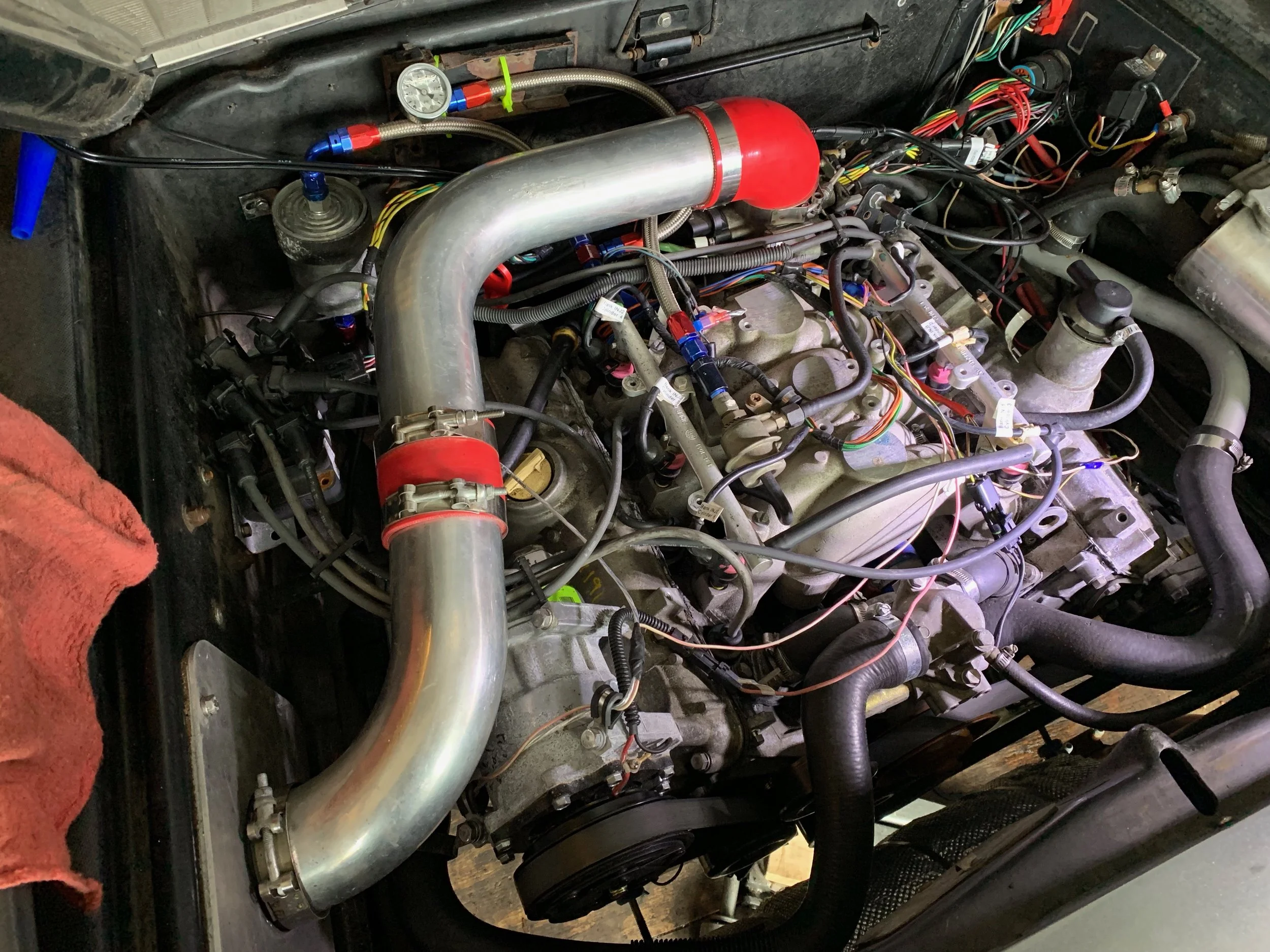 The new wires routed through the engine bay.