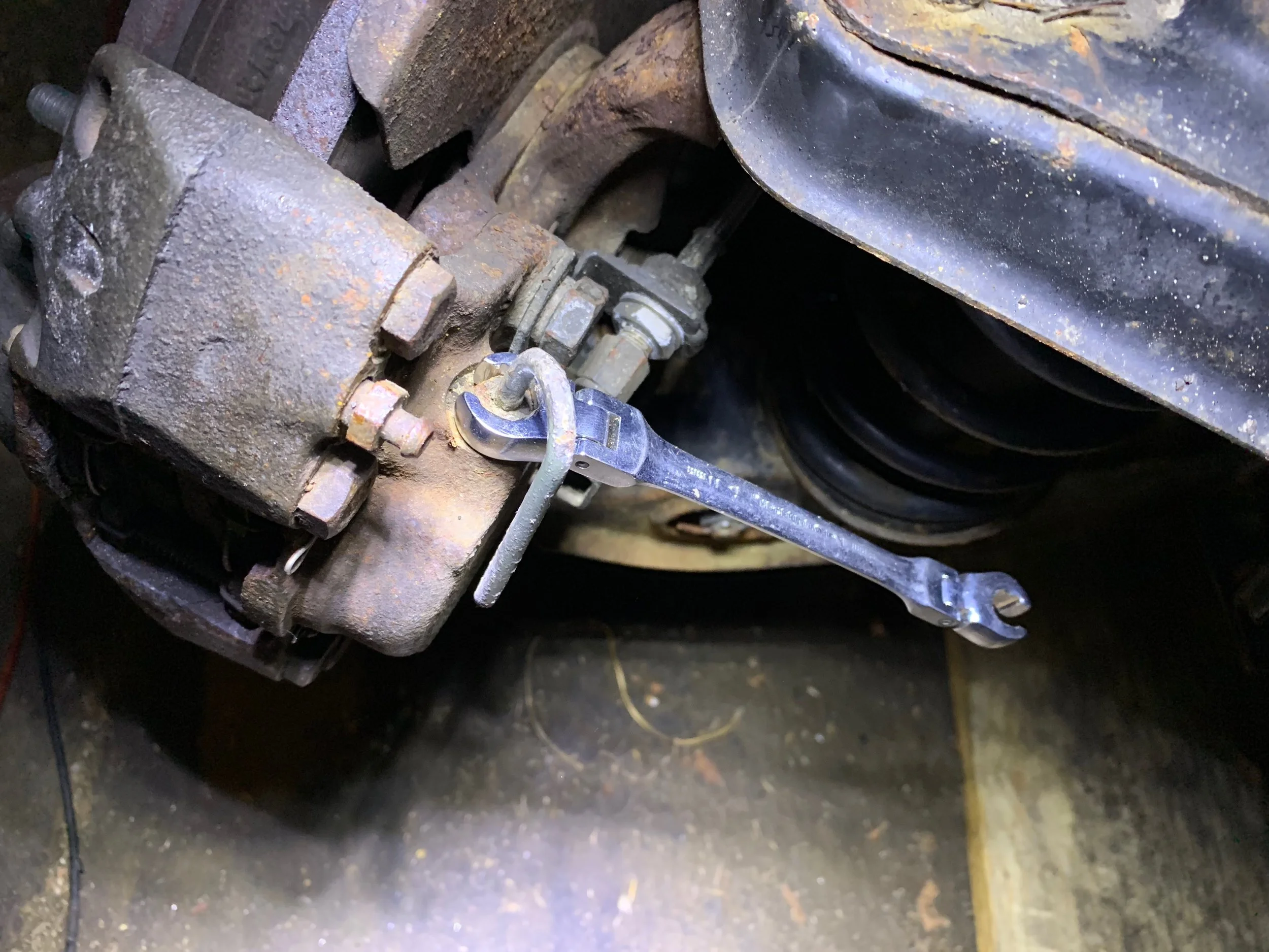 An 11mm flare wrench used to remove the brake line from the caliper