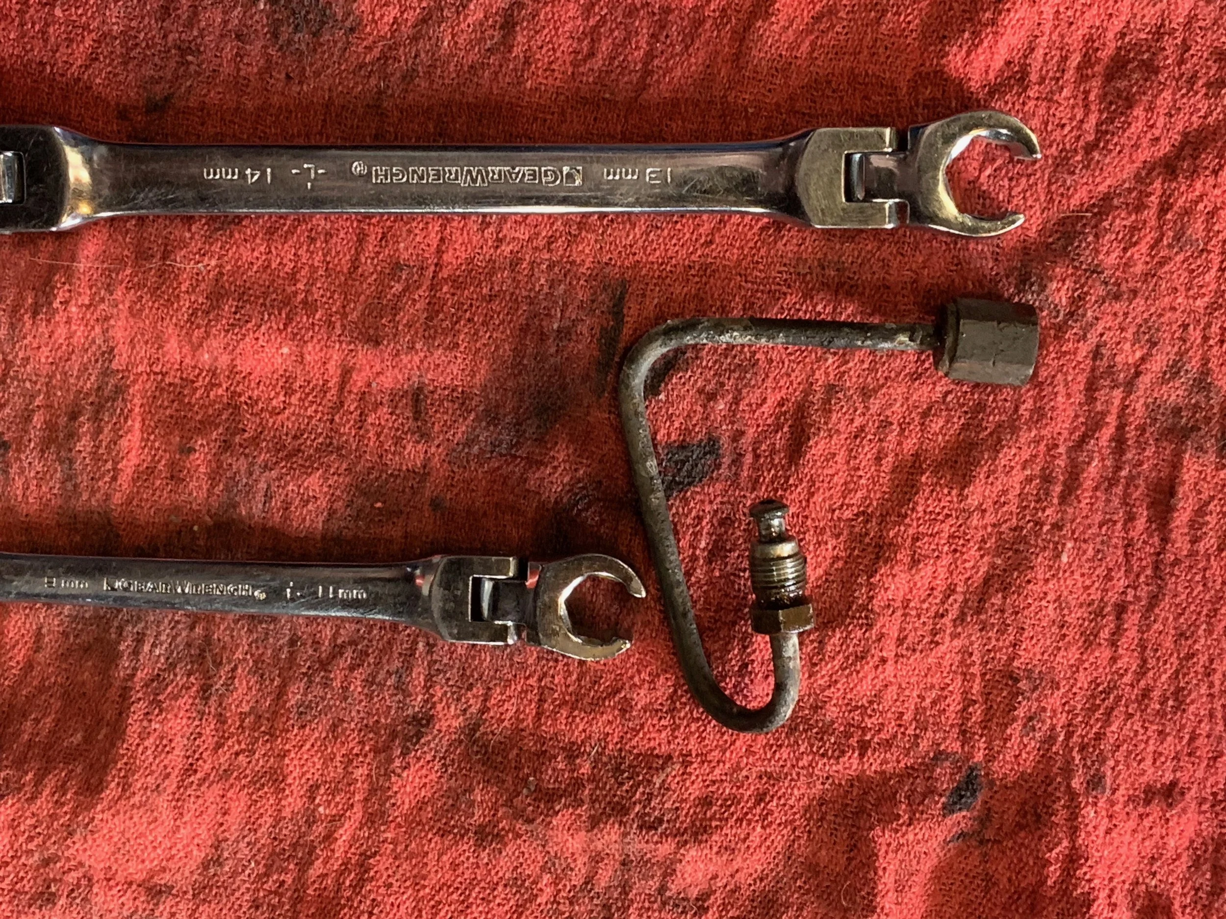 The 11mm and 13mm flare wrenches used to remove the brake caliper hardline, which isn’t strictly required for this.