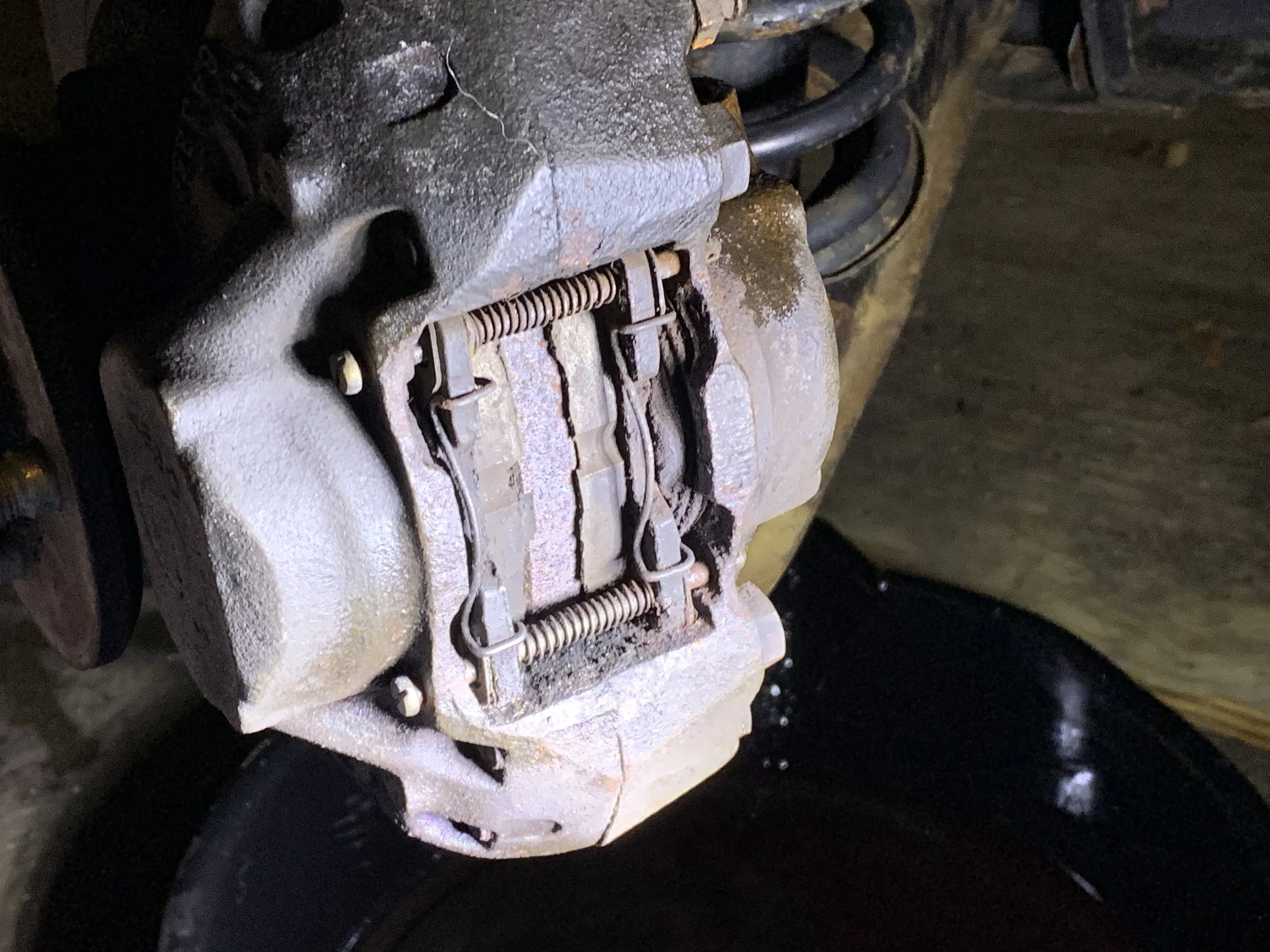 The brake pads still installed in the calipers